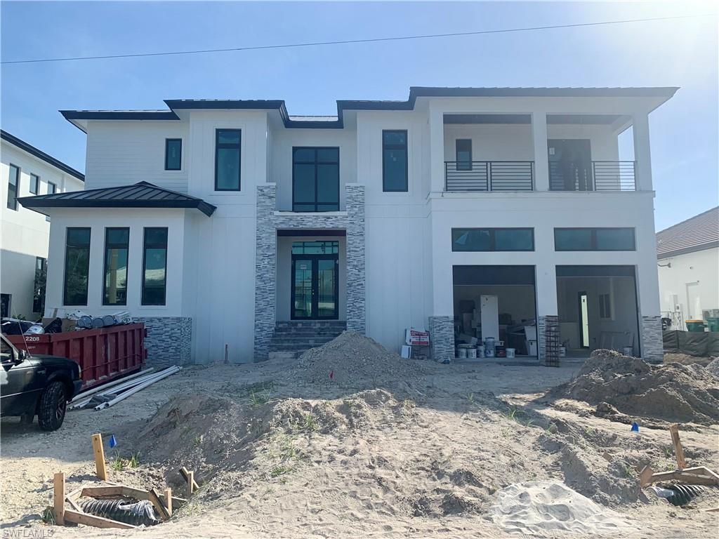 A home unlike any other! Currently the last opportunity to own a brand new constructed home in the highly desirable and sought after Unit 10 (South End of Marco). This home sits on an extra wide canal that offers one of the fastest outs to the Gulf on the island. No expense has been spared on this home. New seawall, boat dock with two lifts, elevator, and so much more. This stunning property masterfully blends quality, elegance, and comfort.