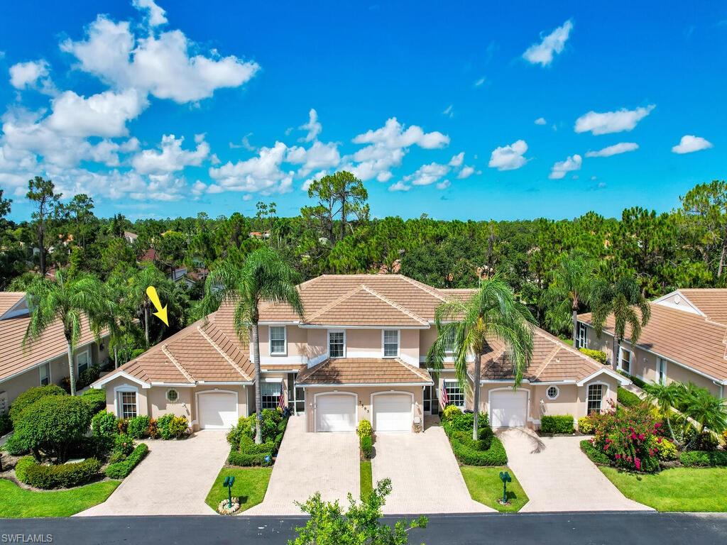 This rarely available, remodeled/updated end unit, 2 bedroom plus den (or 3rd bedroom), 2 bath, single story villa with attached garage features a large open formal dining/living area.  Bright and airy it flows out to the private, shaded glass enclosed lanai which has been remodeled into a Florida room living area with 8 ft pocketed sliders, slider windows and screened for fresh air breezes. Surrounded by lush tropical trees and foliage it's a  very quiet location with a desirable SW exposure. An open floor plan, split bedrooms and a formal open dining room! Engineered oak vinyl plank floorings, ceramic bleached oak tile plank floors, storm shutters, eat-in kitchen with granite counters and birch wood cabinets and premium appliances.  The den, with double entry doors, is the same size as the developer’s bedroom option and a closet can easily be added.  New roof in 2021! The Shores is a gated community located near golf courses, Publix, Starbucks and 6 miles to Olde Naples for shopping and dining and 20 minutes to the beaches!  Amenities include a clubhouse with billiard room, resort style Olympic size heated pool, spa, exercise room, two tennis/pickleball courts and playground!