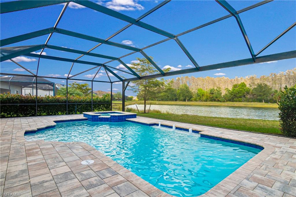Designed with your comfort in mind, the open floor plan features a welcoming interior and contains expansive living areas. The comfortably sized owner's suite is made for relaxation and benefits from a his-and-hers bathroom and a large walk-in closet. The resort like outdoors offers an outdoor kitchen, large pool and spa. A quiet haven where you can really relax. This home features 4 bedrooms, 4 baths and den and a bonus loft. Have you been searching for the perfect place to enjoy active living? With its scenic 240-acre lake, kayaking, electric boating or pier fishing can be enjoyed. Har-tru tennis courts, bocce ball courts and pickle ball courts are available for the sport enthusiasts. Corkscrew Shores offers negative edge pool and a breathtaking brilliant blue lake views. The clubhouse includes private dining/activities room, oversized fitness center, aerobics studio, catering kitchen and conference center. All beautifully decorated and sure to impress.
