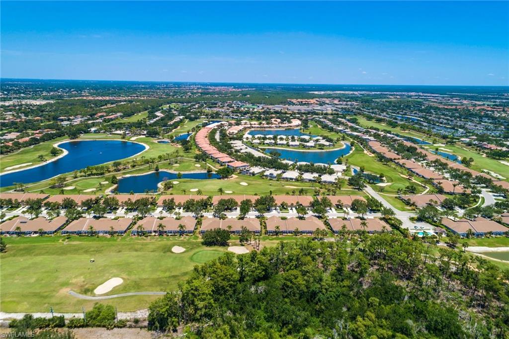 Stunning 3 bedroom 2 bath Twin Villa with an extended lanai & exceptional first class upgrades, with the best long lake view at Heritage Greens Community. This home boasts of numerous upgrades to include hard wood floors, oversize ceramic floor tiles, plantation shutters, designer ceiling fans and lighting, Hunter Douglas electric automatic vertical blind, designer curtains, & the master bath has a shower and oversize soak tub. This home is truly move in condition and shows like a model