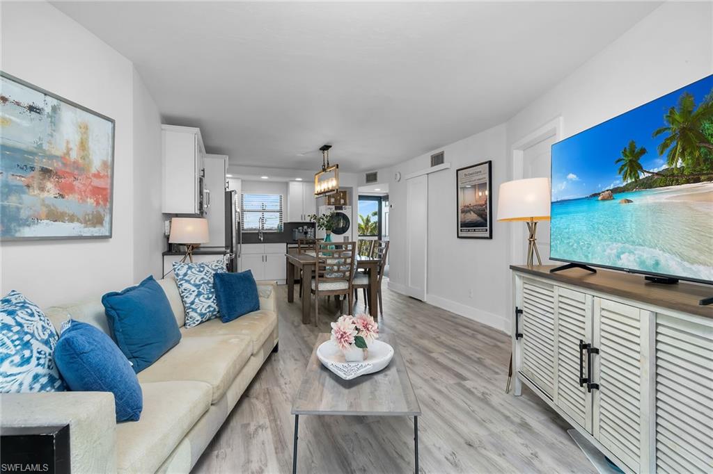 Now Offered at an Exceptional New Price. Best Deal at Angler’s Cove in Marco Island! Elegant fully renovated condo featuring in-residence washer & dryer, weekly rentals allowed, and exceptional income-producing potential in one of Marco Island’s waterfront communities. Experience the best of Marco Island waterfront living in this beautifully renovated contemporary 1-bedroom, 1-bath residence at the highly desirable Angler’s Cove, perfectly situated directly on the Marco River with direct Gulf access. Designed with comfort, style, and functionality in mind, this move-in-ready condo offers the ideal blend of coastal elegance and resort-style amenities. Step inside to discover a stunning modern kitchen featuring white shaker soft-close cabinetry, quartz countertops, a commercial-style pull-down faucet, and stainless steel appliances, including a full-size refrigerator with water dispenser, stove, and dishwasher. Thoughtful upgrades throughout include luxury vinyl plank flooring, new trim and baseboards, updated interior doors and hardware, a new electrical panel and plumbing, and a spacious pantry for added convenience. The inviting living space is complemented by impact-resistant windows and sliding glass doors, allowing natural light to flow throughout while offering peace of mind and energy efficiency. The spacious primary bedroom features dual closets, additional storage, and partial water views, creating a relaxing private retreat. The fully remodeled bathroom showcases a sleek modern design with an elegant shower stall and hidden storage cabinetry. Additional upgrades include a GE washer and 240-volt ventless dryer with dedicated circuit breaker, new water heater, black aluminum screened front door with glass, and an advanced A/C system with Blue Light technology designed to improve indoor air quality. Set on 13 beautifully maintained waterfront acres, Angler’s Cove offers exceptional resort-style amenities including: two swimming pools/two spas, two tennis courts, boat dock leasing, direct Gulf access, on-site tiki restaurant with riverfront views  Even more impressive, the condo fees include cable, internet/Wi-Fi, electricity, and water providing exceptional value and convenience. Whether you’re searching for a full-time residence, vacation getaway, or investment property, this exceptional waterfront condo offers the ultimate Marco Island lifestyle where every day feels like a vacation.
