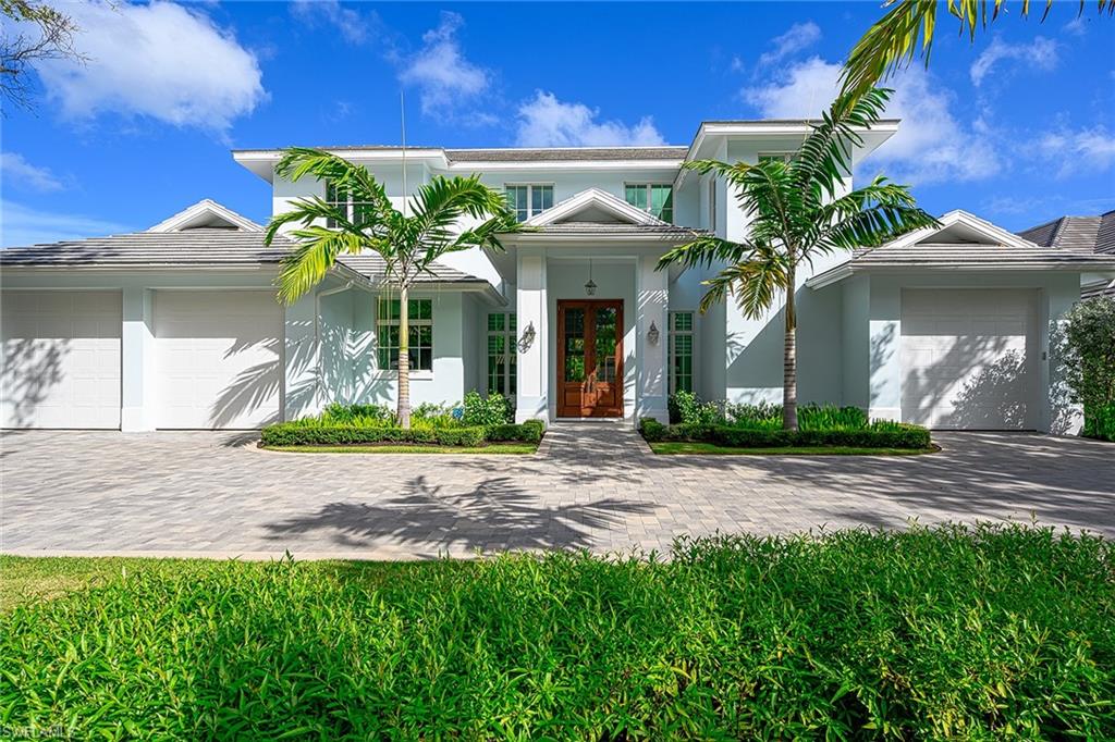 Idyllic residence nestled on beautiful tree lined Riviera Drive and just a short distance to the iconic 5th Avenue S. shopping/dining and the Beach. This newly built home features Coastal styled architecture and striking finishes that complement a design that is wonderfully well-suited to today’s buyers. This ideal floorplan includes just under 5000 Sq. ft. under air, an open great room concept, with the Master + detached guest suite/ cabana / Covid home office  on the first floor and 4 bedrooms  on 2nd floor along with a second family room.    The home is naturally bright, with pocket sliders for seamless indoor /outdoor entertaining and an outdoor space that will make you feel like you are on vacation everyday.  The gourmet kitchen includes top-of-the line appliances, floor-to-ceiling cabinetry, and walk-in pantry with 2nd refrigerator.  Perfectly suited for entertaining with fire bowl water feature pool accents, oversized pool and spa, gas fireplace,  and summer kitchen with automatic screens on the lanai. Features also include solid concrete construction, high ceilings, and a centrally located bar. This home provides the ultimate in Naples living!