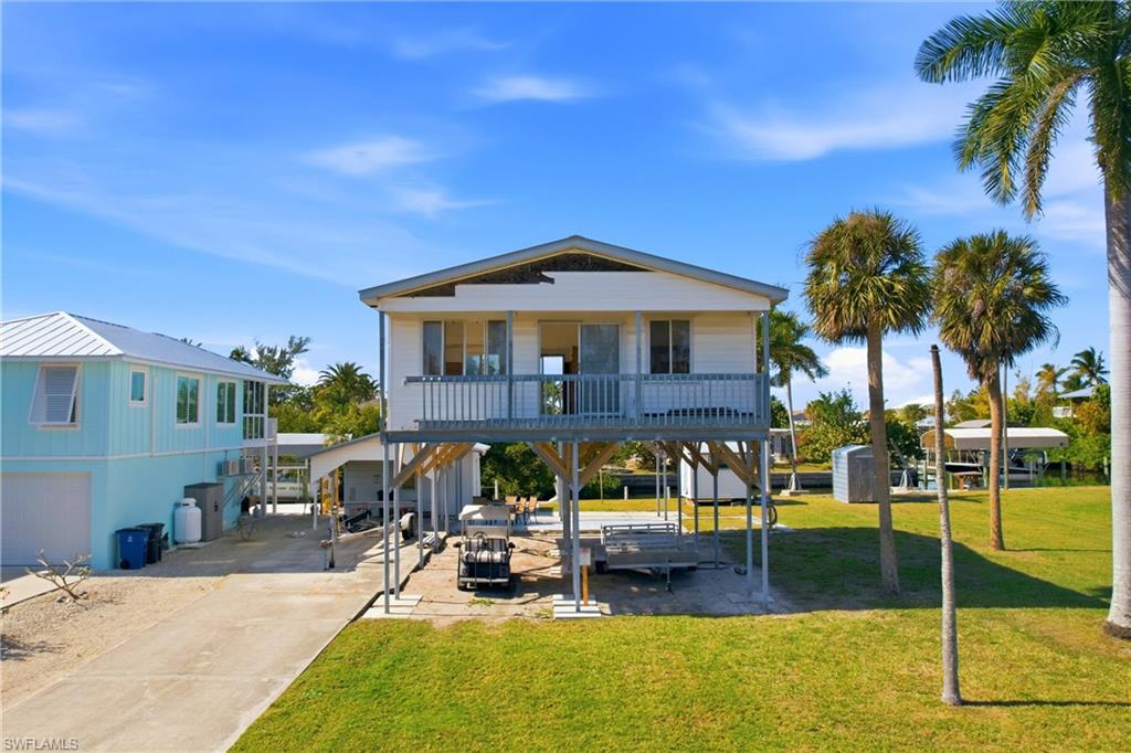 DOUBLE LOT GULF-ACCESS OPPORTUNITY--SELL ONE, REMODEL HOUSE ON THE OTHER OR BUILD NEW
Rare waterfront offering in St. James City with 2 separate lots with direct access and no bridges to open water. This is a true lot-value investment opportunity-keep both parcels for an expansive new home build, continue remodeling existing structure with plans and permits provided by the Seller or sell one lot and recoup a significant portion of your investment.  This property features a concrete seawall, carport, and storage shed, with immediate boating access to open water.  
The existing elevated 2-bedroom, 1-bath structure (832 sq. ft. under air) was impacted by Hurricane Ian and has since been raised above flood elevation. The home is currently uninhabitable and in unfinished condition, with framed walls and floor stringers in place, offering the option to renovate or remove and build new.
Whether you're an investor looking for land potential, a builder seeking two buildable parcels, or an end user wanting space and waterfront access, this property presents exceptional upside in a desirable Pine Island boating community. 
The sellers have already completed significant upfront work and secured a permit along with architectural and construction plans, all of which can be conveyed to the Buyers. 
Cash buyers or renovation financing only. Sold AS-IS.