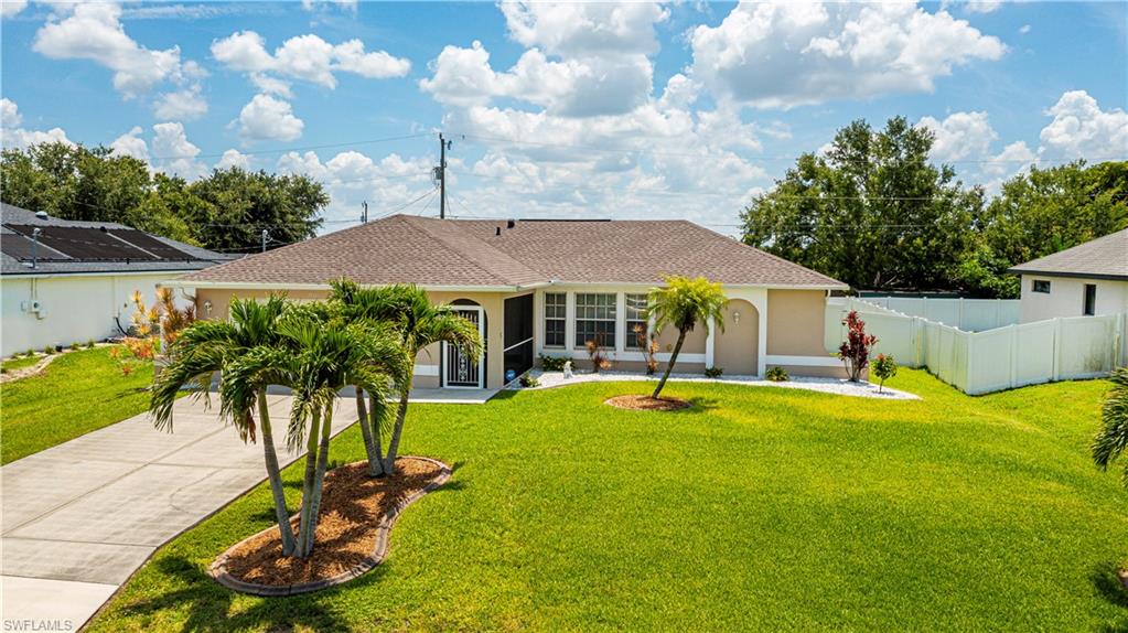 Meticulously cared for home with a FENCED yard and upgraded ROOF (2022) on CITY WATER and sewer and in a NO FLOOD zone.  This pristine home is move- in ready with nothing to do!  It features open concept living with a vaulted ceiling and tile floors throughout. The kitchen has granite counters with newer SS appliances   
The split bedroom floor plan offers privacy with the primary able to fit a king bed- the attached private bath has new shower doors. The large screened lanai leads to a beautiful and spacious backyard with a separate fenced in dog area, a shed for extra storage and plenty of room for a pool. The laundry room has a GE washer and dryer and upper cabinets for storage. The garage has Epoxy floors for durability and the water heater is 6 months old The roof has a transferable 30 year warranty!  With hurricane shutters and a generator hook up you will have peace of mind. 
Situated on a quiet residential street among newer construction,its  conveniently close to shopping, dining, and schools. This the perfect home for a first time buyer or a retiring couple!