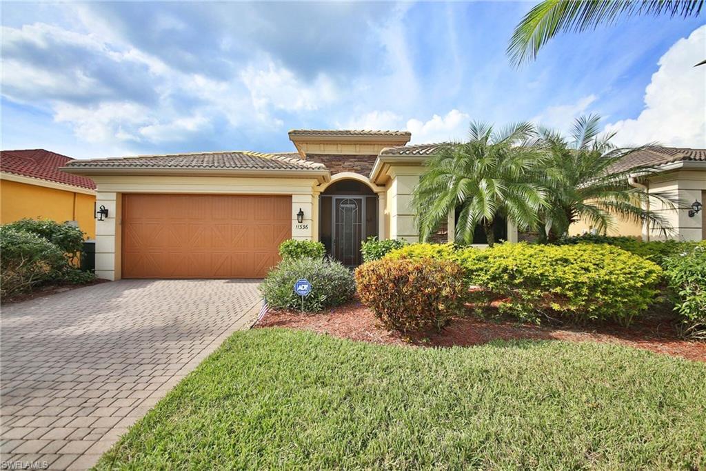 Luxury model, built by Engle homes, on a picturesque lake with beautiful sunsets in the evenings. You'll love the upgrades including newer granite throughout, newer appliances, electric hurricane shutters in front and back of home, cellular shades (even on slider doors), 42" upper cabinets in kitchen, walk in closets, Acacia wood flooring in bedrooms and epoxy flooring in garage. This home is in mint condition and move-in ready! New Air Conditioner Aug 2016. Home did not receive any damage from hurricane Irma. Outside boasts a HUGE EXTENDED LANAI and lush tropical landscaping. You won't want to leave your backyard! The view is stunning! When you walk outside your door to explore the community, it's just walking distance to the clubhouse & amenities!! Reflection Isles is one of the most desirable gated communities, conveniently located in the Daniels Corridor! Enjoy basketball, tennis, community pool/spa, clubhouse, fitness center & tot lot! This community has a social committee & is always planning fun things for all ages! Close to shopping, dining, I75 & airport! You won't find another community with LOW HOA'S that include SO MUCH VALUE!