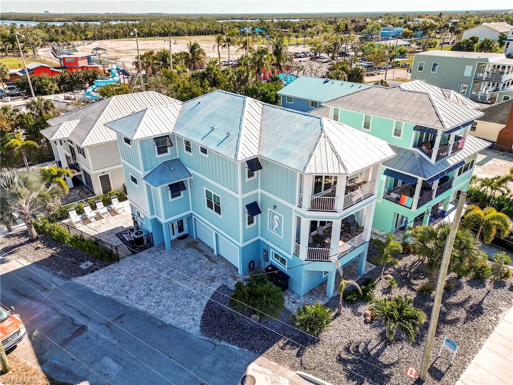 Wake up to breath taking unobstructed Gulf views.  This stunning property offers the perfect blend of Coastal elegance and beach living.  Expansive windows and private balcony showcase unforgettable sunsets.
Inside, you will find an open concept layout designed for comfort and entertaining with spacious living area. Located just steps from pristine beaches this is ideal as a primary residence, vacation retreat or investment opportunity.
Home is in the weekly rental district with  a strong vacation rental history and is the  closest home on Estero Blvd  to the Downtown Entertainment area. Four bedrooms and  three and 1/2 baths with accommodations for an elevator. There are two king suites, one Queen and Twin Bedroom. Alcove area for office or sitting area. large kitchen, dining and great room area for family gathering and entertaining.
Residence has a new roof and new exterior paint in 2024.

Home features a two car enclosed garage area with additional storage and game room for entertainment for children and adults.
Large heated pool with spacious paver deck area for catching the sun rays  and under the home covered  patio for relaxation and outdoor eating. Two grills and plenty of seating for outdoor cooking and dining with the family.
Cross Estero  Blvd and you are steps from the pristine Beach   Take an early evening stroll on the Beach and enjoy spectacular sunsets.

Whether you are looking for a high performing investment property or personal getaway, this coastal rental offers strong appeal with its prime location and true vacation feel.
turnkey and guest ready, its an exceptional opportunity to own a piece of Gulf lifestyle..
This Gulf View Gem delivers the ultimate in coastal living.