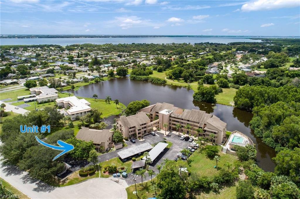 GROUND FLOOR-END UNIT ON LAKE!!!! Serene Setting with Peaceful Water views off Rear Screened Lanai and Shade Canopy Trees out Front**Parking Space is at Your Front Door & Ample Guest Parking**Beautiful Tropical Foliage and Wildlife to Unwind your Mind**RARE 2 Separate Lanais/Balconies**Split Bdrm Floor Plan**All Tile & Wood-like Plank Flooring in Bdrms**Wet Bar in Main Living Space**Mstr Bdrm boasts Large Bathroom with Dual Sinks, Remodeled Shower & Substantial Closets**Spacious Guest Bdrm with it's own Bath & Remodeled Shower**HVAC new in 2014**Community Pool**2 newer Viewing Docks extending out over Lake**Have a boat? Paradise Marina is just up the road & the River is nearby**PAY NO City Tax here**Annual Leases only**Come make this Gem Your Own!