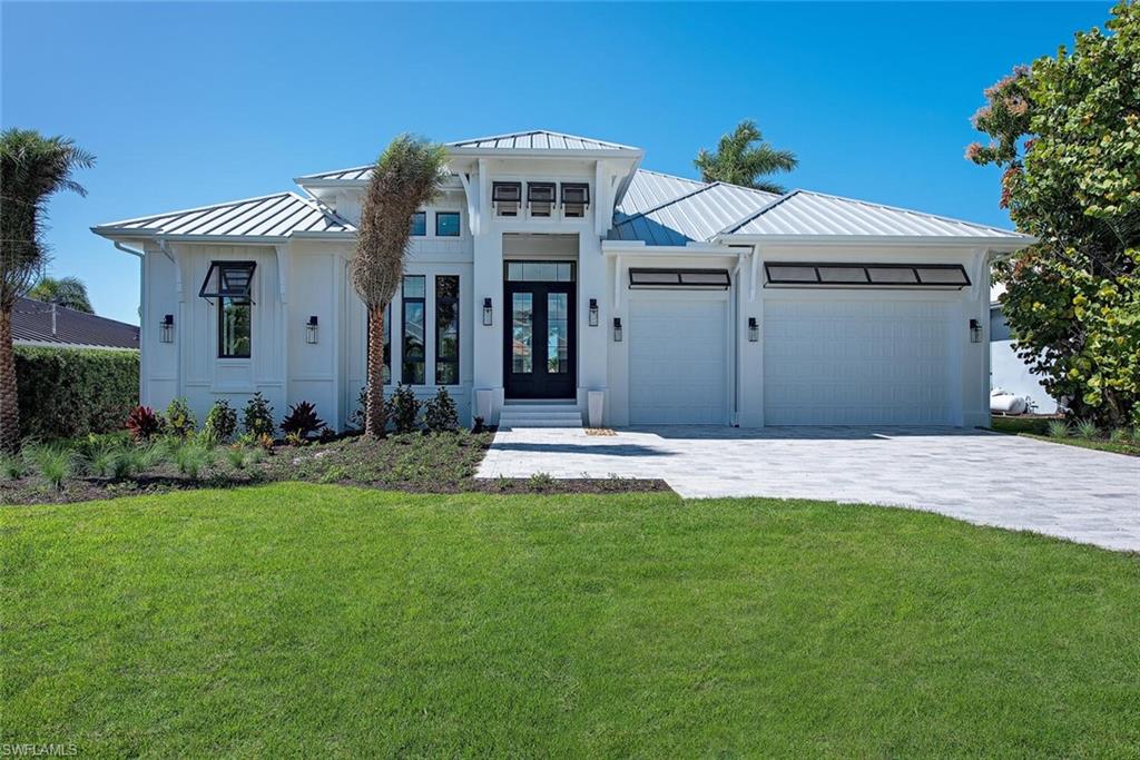 Gorgeous custom build by Oakwood Custom Homes will be available end 2020. Beautiful details throughout with fine craftsmanship. The coastal contemporary has an open floor plan, 4 bedrooms plus den, beautiful lanai & outdoor kitchen and luxury pool. Lots of detail in this luxury plan with a stunning kitchen, high end appliances and other beautiful details throughout. 3 car garage and western views with easy no bridge access to the Gulf of Mexico.