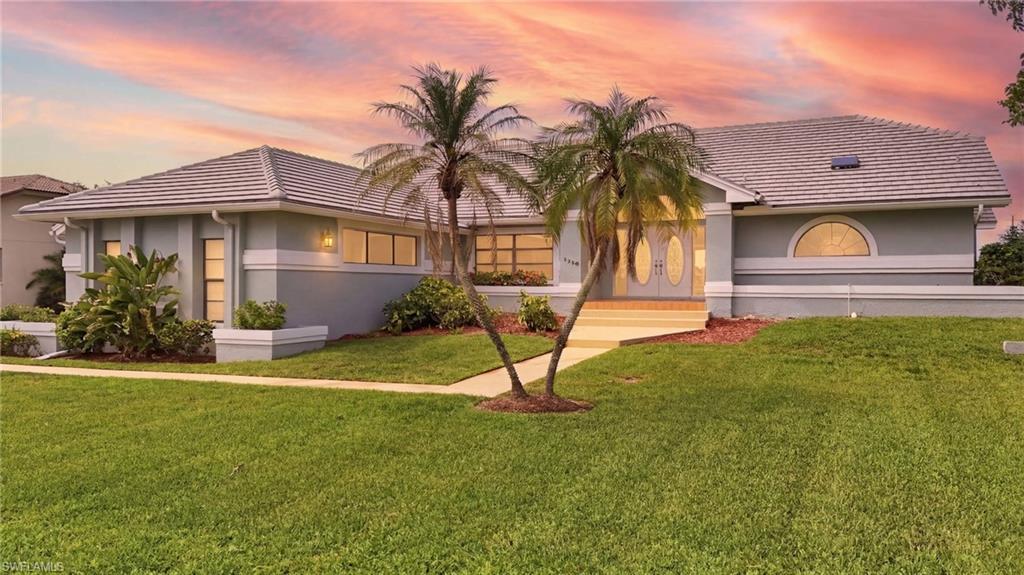 Experience the ultimate Southwest Florida waterfront lifestyle in The Harborage in Fort Myers, a premier gated boating community. Perfectly positioned on an oversized double waterfront lot with 130 feet of lake frontage, this beautifully maintained custom home offers spectacular sunset views framed by expansive picture windows that seamlessly blend indoor and outdoor living.  Designed for both comfort and entertaining, the home has been thoughtfully updated with a newer roof, exterior paint, air conditioning system, carpet, pool equipment, garage door, and irrigation system, offering peace of mind for years to come. Cozy up by the interior fireplace on cooler evenings, then step outside to the spacious screened lanai, where plumbing and electrical are already in place for your dream outdoor kitchen.  Residents of The Harborage enjoy exceptional amenities with low HOA fees, including a private community boat ramp, boat and RV storage, clubhouse, swimming pool, tennis and pickleball courts, and a basketball court.  Ideally located in the heart of Fort Myers, you're just minutes from premier dining, shopping, I-75, Southwest Florida International Airport, and approximately a 20-minute boat ride to the Gulf beaches.  Whether you're searching for a full-time residence or a seasonal retreat, this home offers the perfect combination of waterfront beauty, boating convenience, and the relaxed Florida lifestyle!