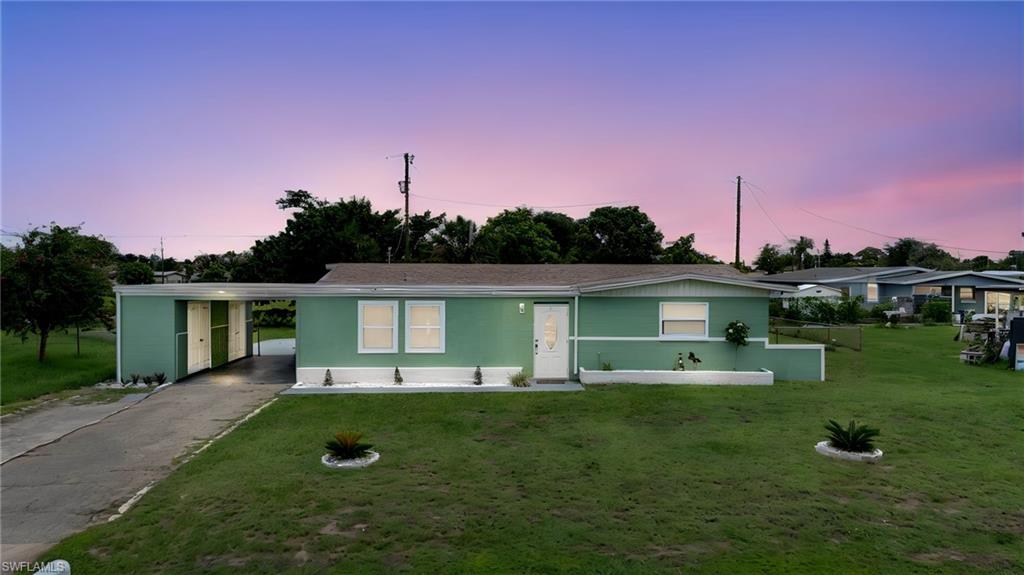 Welcome to this beautifully maintained 2-bedroom, 1-bath home offering comfort, convenience, and plenty of versatile living space. A rare find in Lehigh Acres, this home is already connected to city water and sewer, saving buyers the expense and maintenance associated with well and septic systems.
This move-in-ready home features numerous updates, including a new roof (2019), newer A/C, a new tankless water heater, and a completely remodeled bathroom.
The kitchen is equipped with wood cabinetry, granite countertops, and ample storage, while tile and luxury vinyl plank flooring throughout provide both durability and easy maintenance.
In addition to the main living areas, you'll find a finished front room and a bonus room with a separate entrance in the rear of the home—perfect for a home office, playroom, hobby room, guest space, or additional flex area.
Outside, the attached carport is complemented by two large storage closets, providing plenty of room for tools, outdoor equipment, and extra storage.
Conveniently located just minutes from shopping, restaurants, schools, and everyday amenities, this home offers an ideal combination of updates, functionality, and location. Whether you're a first-time homebuyer, seasonal resident, or investor, this property is one you won't want to miss.