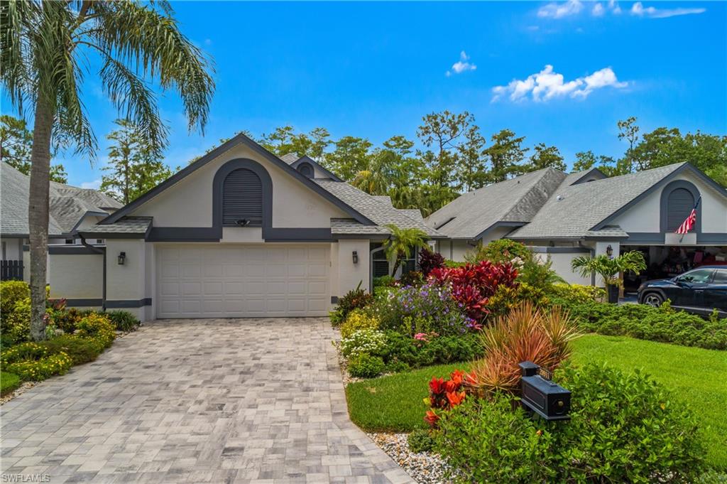 Rare Find in Lakeside Villas at Wildcat Run. Priced below Lee County Property Appraisers assessed value!  Beautifully updated villa offers over 2400sqft with 3 large bedrooms, 2 full bths, powder bath and oversized 2 car garage with new epoxy flooring. Stunning lake views from picture framed outdoor screened lanai with outdoor summer kitchen w/granite countertops and outdoor TV is perfect for entertaining year-round. High vaulted ceilings and transom windows bring in natural light all day and captivates you the moment you walk through the double glass doors into the living room with beautiful custom built-in wall unit with lighting, built-in electric fireplace, new custom cornices and electric remote blinds. Large primary suite offers crown molding with new paint and wallpaper, plantation shutters and private views to beautiful lake and preserve. The primary bathroom has been renovated with new sink, custom cabinetry with lighting, granite tops, Whirlpool spa tub and separate walk-in glass shower. The primary bedroom has a large walk-in closet with built-ins that offers space for every wardrobe. The dining room is open to the living room with a private courtyard and custom lighted wall unit. Elegant kitchen is perfectly designed with stainless steel appliances and granitite countertops, built-in desk, upgraded cabinets and window above the sink. Off the kitchen is a casual dining area open to the family room. This beautiful space offers a new custom built-in wall unit with custom lighting, shelves, and lower cabinets for storage. The guest bathroom has been totally remodeled with custom cabinetry, sink, lighting, new shower and granite tops that is perfect for any visitor. Second and third bedrooms offer custom built-in closets with designer sliding doors, crown molding and plantation shutters. This home has hurricane impact resistant windows and doors, newer roof 2019 and home warrenty for 2yrs. Tile and wood floors throughout the entire home, surround sound speakers inside and outside throughout, new LED recessed lighting on dimmers throughout home and new upgraded fans and chandeliers. Oversized laundry room with w/upper and lower cabinets, granite counter tops and laundry sink. Beautiful lush upgraded landscaping surrounds the entire home with new pavers on the driveway and pathways of the perimeter of the home, new gutters, and new hardwired landscape lighting in the front and backyard with timer. This is a gorgeous home you must see to appreciate.  Wildcat Run is a premiere Golf and Country Club located in beautiful Estero. Wildcat Run offers full-service restaurants, fitness center, wellness center, bocce, tennis and pickleball courts. Golf memberships are available! Wildcat Run is the perfect location between Naples & Ft Myers, minutes from Miromar Outlets, Gulf Coast Town Center Mall, Hertz Arena, SWFL Intl Airport, schools, shopping, restaurants and close to beautiful beaches. Watch the virtual video tour! Contact for a private showing.
