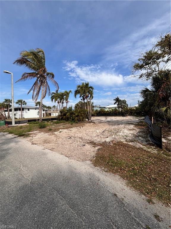 Beautiful mid island location.  Large lot 75 X 98, cleared and also has inground pool that can be rehabbed.  Across the Street from the Gulf in the unique neighborhood of Gulf Island Manor.   Together the owners share ownership to a private Beach Front Gazebo with outside shower, tables and chairs and also a Bayfront Park with Large Tiki 
to have gatherings with table and chairs.  Plus a "Marina" like setting with a t-dock fishing pier with fish cleaning
station directly on Estero Bay, very private and owned by the Gulf Island Manor Owners.   Very unique setting.
Ideal location to build your dream forever home or a vacation cottage.  You will love this neighborhood and location.  Can provide builder information upon request.  Build your forever Beach Home.