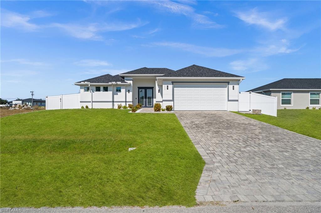 Seller motivated! Stunning 2023 build offering 3 BEDROOMS and 2 BATHROOMS with IMPACT WINDOWS AND DOORS, located in a desirable area with NO FLOOD ZONE requirements. This home features an OPEN FLOOR PLAN with TRAY CEILINGS, ROLLER SHADES, and a beautifully appointed KITCHEN with QUARTZ COUNTERTOPS, sleek cabinetry, and stainless steel appliances. The spacious PRIMARY SUITE offers a LARGE BEDROOM, generous closet space, and a contemporary bathroom with elegant finishes. Enjoy exceptional outdoor living on the EXPANSIVE LANAI with FRAMELESS SCREENS, ample space for entertaining, an OUTDOOR TV setup, and a HEATED POOL that creates a true private retreat. Additional highlights include a LAUNDRY ROOM WITH CABINETS AND SINK, a VINYL-FENCED YARD, and a PAVER DRIVEWAY. Built with quality and designed for comfort, this home delivers modern style, thoughtful upgrades, and the effortless Florida lifestyle buyers love.