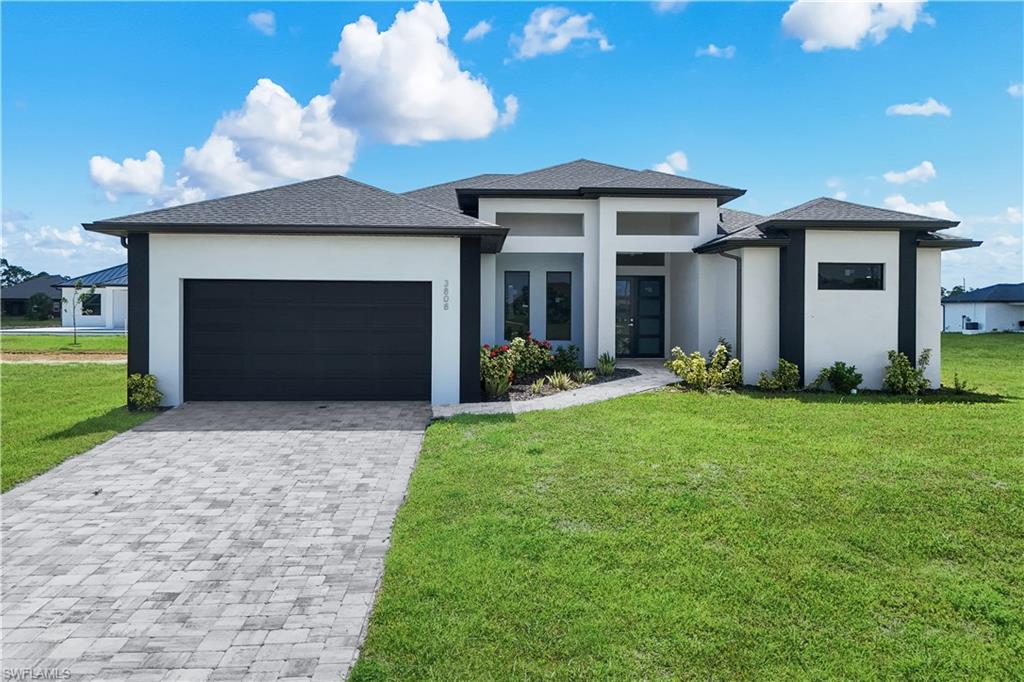 Located in one of Northwest Cape Coral’s fastest-growing and most desirable areas, this modern new construction home blends contemporary design with relaxed Florida living.This open-concept residence features sleek tile flooring throughout and a bright, airy layout designed for both comfort and entertaining. The kitchen flows seamlessly into the main living space, creating an inviting environment that opens directly to the outdoor lanai and screened-in pool area.Enjoy true indoor-outdoor living with direct access to the pool from both the master bedroom and the main living room—perfect for morning coffee, evening relaxation, or entertaining guests. The western exposure brings beautiful afternoon light and sunset views, enhancing the outdoor living experience.
The home offers a spacious two-car garage, excellent elevation for added peace of mind in regard to flood considerations, and a modern design built for today’s lifestyle.
Just minutes away is Crystal Lake Park, a local favorite offering walking trails, a sandy beach area, playgrounds, picnic pavilions, and bike paths—an ideal setting for recreation and community connection.
This location perfectly balances privacy and convenience. Whether you prefer peaceful evenings at home or an active lifestyle with outdoor activities and neighbors nearby, this property delivers both.
A truly ideal place to live, relax, and enjoy the best of Southwest Florida living.