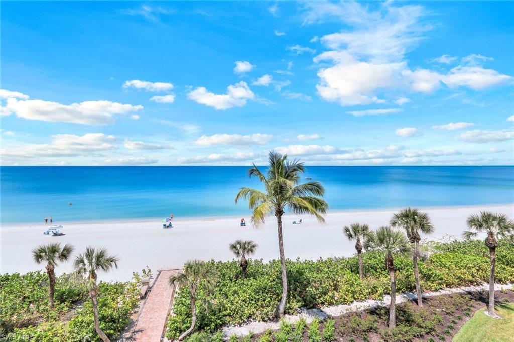 Your quiet, serene beachfront retreat awaits! Take in all the beauty that Vanderbilt Beach in Naples has to offer. Enjoy a morning walk along the waters edge, a cup of coffee from the 4th floor lanai, and spectacular sunsets in the evening. With modern comforts and coastal charm, this 2 bedroom plus den, 2 bathroom condominium is sure to please. A palette of neutrals and light tones will awaken your senses while you take in stunning views of the Gulf of Mexico from nearly every room. Relax and we'll do the rest! New living room furniture, flooring throughout and a fully equipped kitchen will have you feeling right at home. Enjoy the amenities of the community including a large swimming pool, private beach access, and outdoor showers. Conveniently located near several dining options, shopping, fitness centers, parks and movie theaters as well as Publix and Whole Foods market.