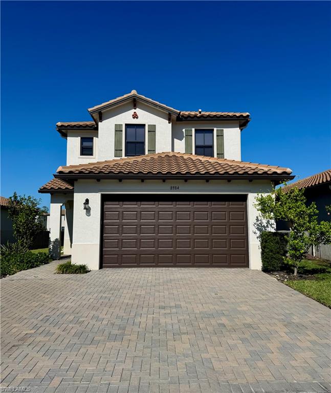 Available starting July! This grand two-story home, located in the Fronterra community, has 3 bedrooms, 2.5 bathrooms, a 2-car garage and lake view. Built in 2020, this home feels like new! Open floor plan featuring living/dining, kitchen with island with quartz countertops, stainless steel appliances, gorgeous glass/metal backsplash, updated lighting, neutral grey paint throughout, and more. The spacious Primary suite with views of the lake, double vanities, walk-in shower, white cabinets, granite counters and custom framed mirrors, is located upstairs as well as the two guest bedrooms and laundry room. The extended back patio was designed for relaxing and entertaining overlooking the lake. Garage floor has been upgraded with stone gray epoxy. This gated community offers a community pool and cabana and is located close to shopping and a short drive to the beautiful white-sand Naples Beaches and world-class dining and entertainment.