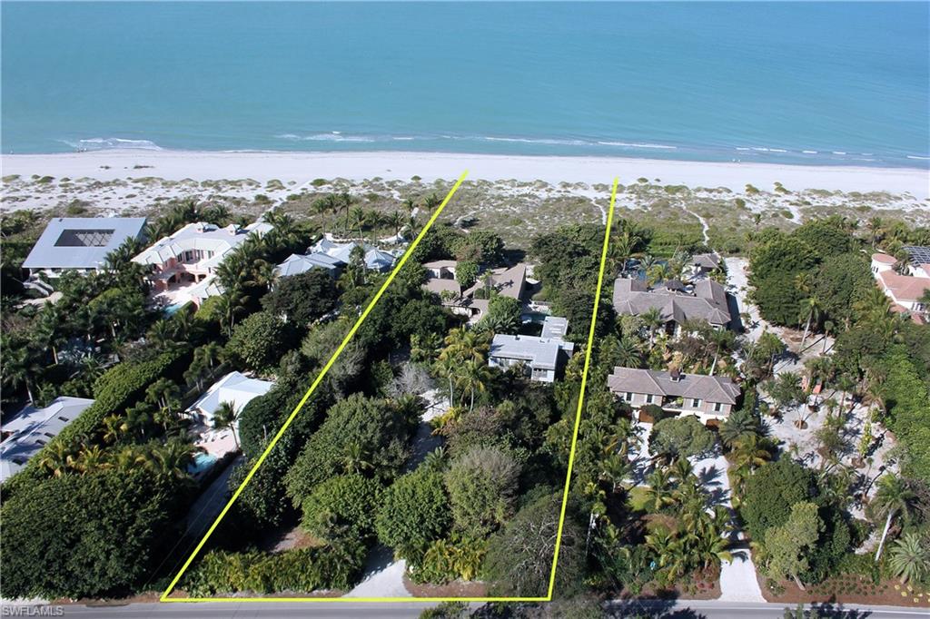 Nestled on 150 ft of prime beachfront property, this landmark home designed by the renowned American architect, Charles Moore, blends seamlessly into Captiva's tropical environment. Modernized in 2010, featuring stunning architectural detail throughout, the main home has soaring ceilings, walls of glass overlooking the Gulf, 4 bedrooms, 4 baths and 2 outdoor showers. A delightful pool sits between the main house and the guest house, which was designed to accommodate a large family. Built in 2004 with 4 bedrooms and 4.5 baths, the guest house all but disappears into the artfully designed landscape. A covered walkway links the 2 houses, each of which has a breathtaking Gulf view. Recent upgrades include paver driveway, remodeled pool, new beach path, new kitchen appliances, new paint inside and out. There is a Guest house elevator and enclosed and small boat storage.  16464 Captiva Dr is an incredible Captiva Island beachfront estate!