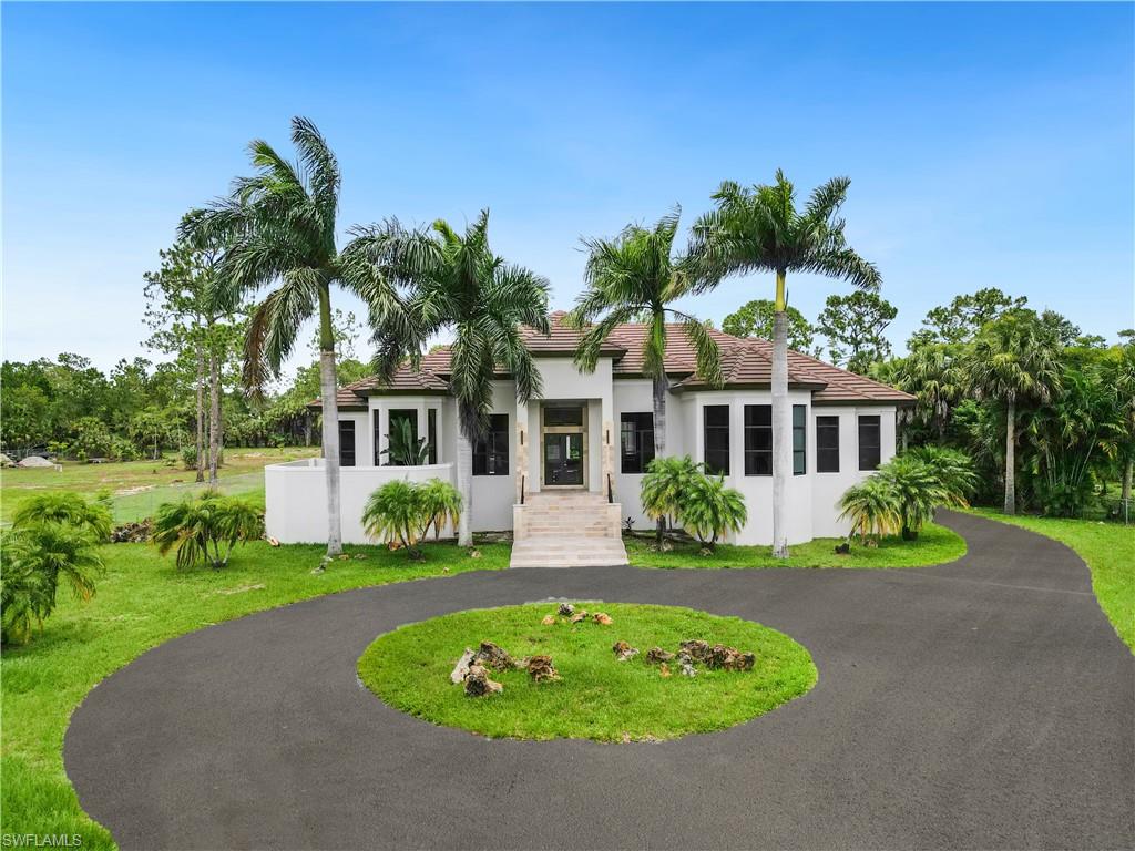 One or more photo(s) has been virtually staged, AI generated or rendered.  Experience true luxury in this fully remodeled 5,200+ sqft estate featuring six bedrooms, five and a half bathrooms, and a private mother-in-law suite complete with its own bedroom, kitchen, and living room. Completely renovated in 2022, this home offers a new roof, HVAC system with ductwork, updated electrical and plumbing, new framing, drywall, and insulation, 24x24 marble flooring throughout, impact-resistant windows and sliding doors, modern kitchen and bathroom cabinetry with quartz and granite countertops, new doors and trims, upgraded garage doors and motors, fresh interior and exterior paint, a new irrigation system, and a reverse osmosis water treatment system. The backyard is designed for relaxation and entertainment, featuring a fully remodeled resort-style pool and spa with a marble deck, waterline tile, and glass mosaics, along with a built-in outdoor grill area. This exceptional property blends elegance, comfort, and functionality in one of Golden Gate Estates’ most desirable locations. Don’t miss your opportunity to make it yours.