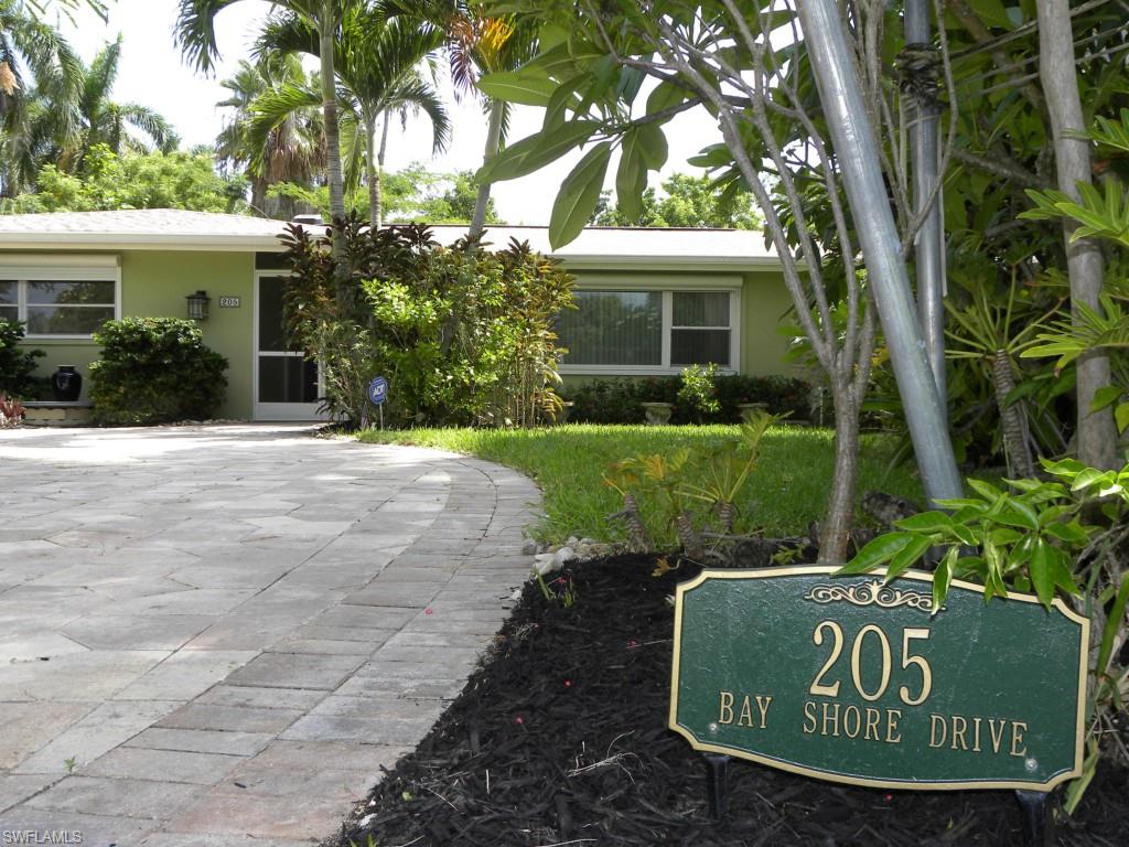 Your Paradise Is Found In One Of Cape Coral's Finest, Well Established, Yacht Club Area Neighborhoods. Your New Home Sits On A Royal Palm Tree Lined Street Across From Basin And River Front Homes! Enjoy The Tropical Paradise Lifestyle Without The Price Tag. The Triple Corner Lot Features Tropical Gardens with Custom Pond, Designed For Koi Fish. A Variety Of Bamboo, And Palm Tree Specimens, Gumbo Limbo, Banana, Avocado, And So Much More. The Centerpiece Of This Private Tropical Paradise Oasis Is An Extraordinary Custom Paver Lanai Featuring: A 14' x 37' Covered Area With 3 Sets Of Sliding Glass Doors Into The Home, Kitchen Pass Through, And Pool Bath; A 28' x 37' Screened Cage, A Solar And Electric Heated Concrete 14' x 28' Pool And A 6' Round Hot Tub. The Property Features Complete Shutter Protection, Portable Generators, And A Newer Roof. The Interior Of The Home Boasts A Split Floorplan With Tile And New Herringbone Wood Floors; 3 Bedrooms; 2.75 Baths; Newer Custom Kitchen with Beautiful Hardwood Cabinetry, Extravagant Granite Countertops And Backsplash, Black Appliances, And A Walk-In Pantry; A Large "L" Shaped Living/Dining Room; Family Room; And 2 High Efficiency A/C Systems.