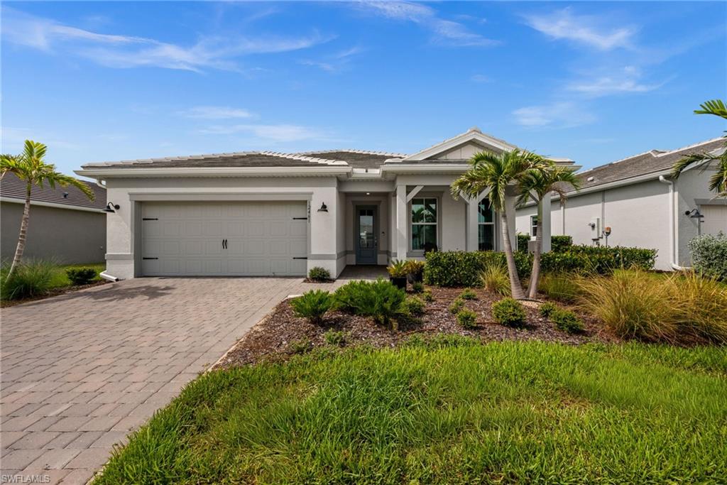 This 2,056 sq ft home in Terra Walk sits in one of Babcock Ranch's most in-demand pockets, and it's been upgraded past standard builder grade. Three bedrooms, a den you can actually use as an office (glass French doors keep it bright but separate), 2 bathrooms, and a 2-car garage with 220 amp EV charging already installed.
The great room is the real draw. Zero-corner sliders push the whole wall open to the lanai, so on a nice day the inside and outside just become one space. There's a trim accent wall back there that gives the room some character instead of feeling like every other great room on the block.
The primary suite has a frameless glass shower, which gives it a spa like feel. It feels bigger and cleaner than a framed one. Laundry room is oversized with real storage, not an afterthought closet. And the little things add up: custom window treatments, upgraded lighting, and ceiling fans in every room, the kind of stuff most buyers end up adding themselves after closing, already done here.
Then there's the location. This home sits just seconds off State Road 31, so getting in and out of the neighborhood for work, errands, or a day trip doesn't eat up your morning. Terra Walk's gated entrance opens to an 8-acre lakeside amenity campus anchored by a 19,000 sq ft clubhouse with a fitness center, golf simulator, card rooms, and The Porch Bar & Grille for poolside dining. Outside there's a resort-style pool and spa, pickleball, tennis, bocce, a fire pit lounge, and a dog park, all connected by walking trails along the lakes. It's a quick trip to Founder's Square for restaurants and live music, and just 1.5 miles to Publix and the Shoppes at Yellow Pine. All of it inside Babcock Ranch, America's first solar-powered town.
This one's move-in ready, worth seeing in person.