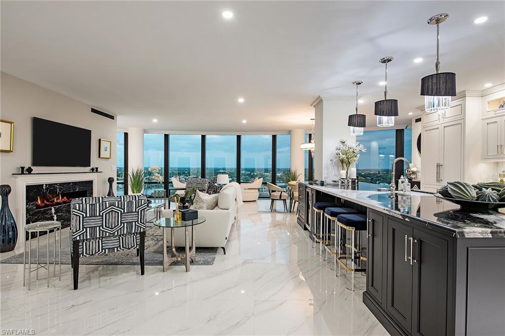 Sleek and sophisticated, newly rebuilt and never lived in. Perched on a higher floor of one of Park Shore's most distinguished buildings, 1505 is the perfect level to take in the sparkle of the city lights and personality of the Venetian Bay waters while still being in touch with the colorful surrounding beauty. One glance at these views, and you're instantly connected with the feel and vibrance of the Gulf Shore lifestyle. Lavish interior elements, including custom Conestoga cabinetry, imported Inalco Spanish tile, a true chef's kitchen inclusive of Miele appliances, as well as a whole-home water filtration system are just a few of the extraordinary interior features you have in this true palace in the sky. Whether you're drawn to the stunning views or the envy-inducing custom interior, the sheer luxury of the design is sure to inspire one's opulent side. Every inch of this residence has been creatively designed with ease of living in mind. The remastered floor plan offers over 2,500 square feet, customized closets, rich furnishings and is offered fully equipped for the buyer to move in and immediately begin enjoying all that Naples has to offer.