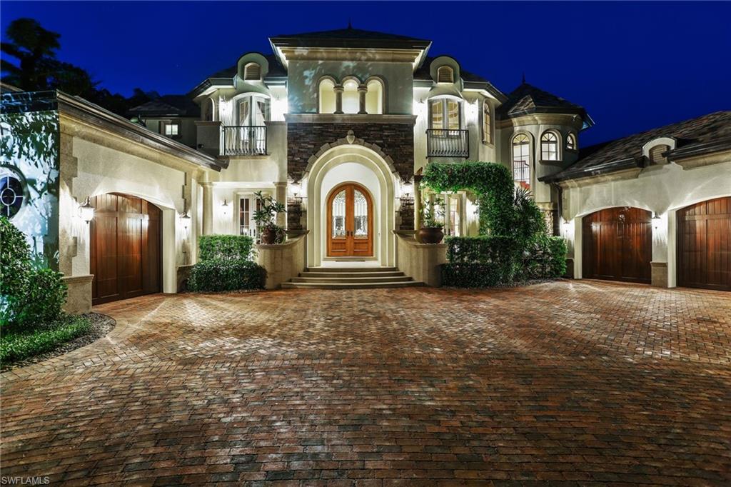 Located on one of the most beautiful streets in Park Shore, this captivating residence with long water views and a southern exposure, is situated on Venetian Bay in close proximity to the beach and Venetian Village. The spectacular light-filled home with high ceilings flows gracefully from one engaging space to another. The great room floor plan was designed with entertaining in mind. An impressive bar, formal and informal dining, and living spaces provide an open concept. Numerous glass doors lead out to a generous covered lanai with an impressive grill station and pool area. The interior living spaces blend harmoniously with exterior spaces and the surrounding vegetation. The kitchen will please even the most discerning chef with custom cabinetry, top-of-the-line appliances, island seating, and plenty of counter space.  The first-floor retreat offers a spa-like bath, two walk-in closets, and a dramatic view of the bay. On the second level, a spacious family room and three additional guest suites offer comfortable and private space for family and friends.  A tropical setting with long water views, this home lives like a sublime waterfront resort and is a MUST SEE!