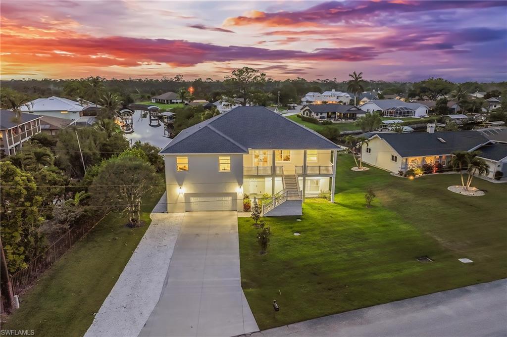 BOATER’S DREAM & FISHING PARADISE FOUND….w/ direct access to the Estero Bay & Gulf in minutes. This new construction, canal front home has been completely transformed with a level of design and craftsmanship rarely seen in the Estero River Heights waterfront community.
Constructed w/ Insulated Concrete Form (ICF) + Solid Concrete Block, every surface, every finish, and every detail has been thoughtfully curated to create a residence exceptionally strong and energy-efficient —ideal for tropical regions vulnerable to extreme weather.
This 3B+Den/2BA pool home has it all…Luxury Vinyl Plank flooring; warm neutral interior color palette; spacious open floor plan; impact resistant doors; hurricane rated windows; upscale hydraulic elevator; lots of natural light and recessed LED lighting. Gourmet-style kitchen features custom white cabinetry, subway tile backsplash; black stainless steel appliances, breakfast bar seating, and black honed granite countertops w/ island waterfall edge flowing seamlessly to the floor. The primary suite is a private retreat featuring a massive walk-in closet w/ custom designed closet systems and a spa-inspired bathroom with dual vanities + sinks, premium fixtures and an oversized walk-in shower that feels like a five-star resort. The guest bath has been finished to the same exact standard. The open lanai w/ coveted western exposure, creates an all-inviting outdoor living space with spectacular sunsets, starry nights and a stamped concrete patio deck w/ large heated pool. Entire ground floor is dedicated garage/storage space with finished epoxy floor - large enough to accommodate 5+ vehicles, boat and/or trailer, wave runners, paddle boards, kayaks and other recreational equipment. Just steps away…..sea wall in place, wrap-around dock constructed with composite decking and canopied boat lift.  A MUST SEE for avid boaters.
