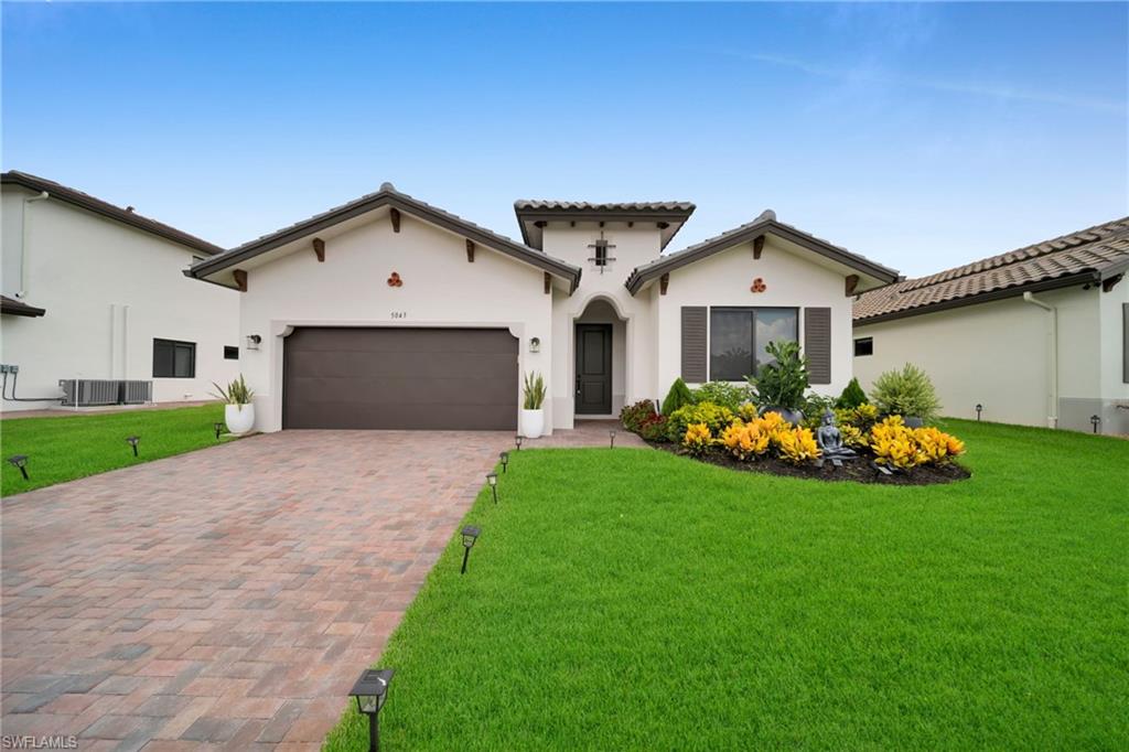 Built in 2025, this beautifully furnished 3-bedroom plus den, 2.5-bath home offers 2,244 square feet of bright, open living space on a premium lakefront lot in the sought-after community of Ave Maria. Light and airy throughout, the home was designed for easy everyday living and effortless entertaining, with the kitchen, dining, and living areas flowing together beneath high ceilings and expansive windows. Upgraded tile runs throughout the entire home, adding a clean, modern finish to every room. The open kitchen features light wood cabinetry, quartz counters, stainless appliances, and a large center island with seating that overlooks the main gathering space and the water beyond. The versatile den works just as well as a home office, media room, or guest space, while the generously sized bedrooms offer comfort and privacy for family and visitors alike. Step outside to a covered lanai with direct lake views and an oversized backyard, the kind of outdoor space that is increasingly hard to find. With a western rear exposure, you get front-row sunsets over the water every evening, making it the perfect spot for morning coffee or unwinding at the end of the day. Thoughtfully built with impact-resistant windows and a durable tile roof, the home delivers modern style along with peace of mind and low-maintenance living. Being sold fully furnished, it is a true move-in-ready opportunity. Living in Ave Maria means more than a beautiful home. Residents enjoy walking and biking trails, parks, golf, tennis, pickleball, fitness facilities, playgrounds, and dog parks, along with a charming town center filled with dining, shopping, coffee shops, and year-round community events. Set in one of Southwest Florida's fastest-growing and most desirable communities, life here feels active, connected, and easy.