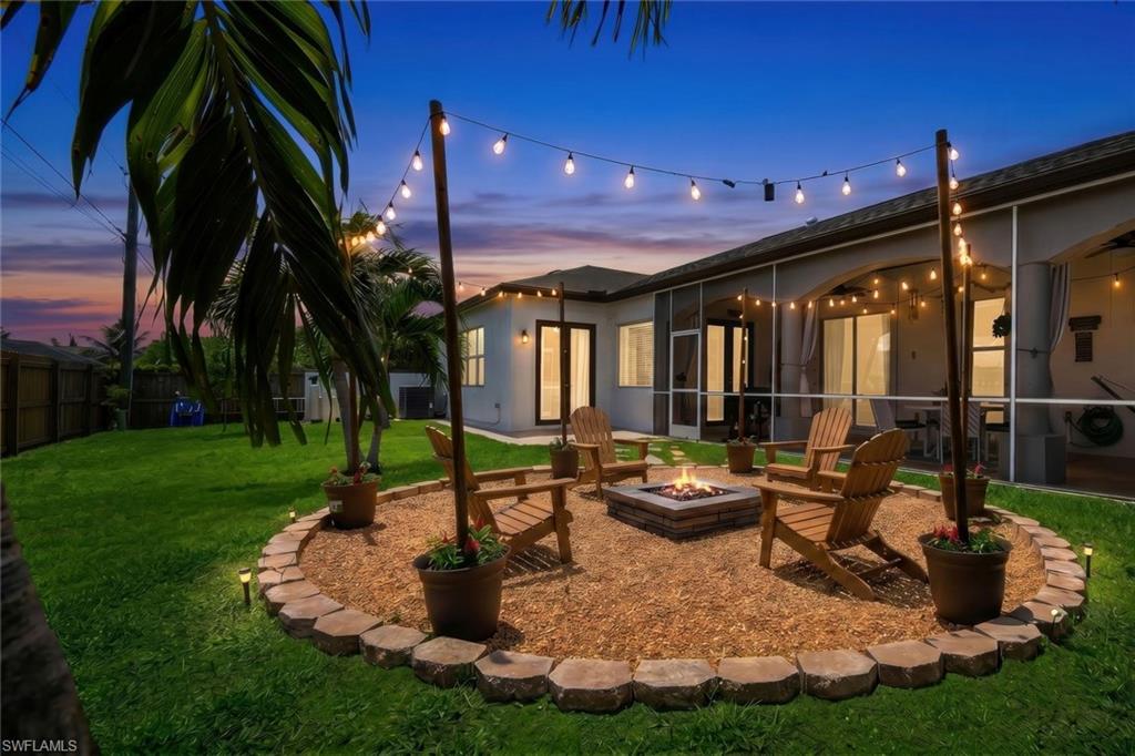 This custom-built 4-bedroom, 3-bathroom home in Northwest Cape Coral offers 2,272 square feet of thoughtfully designed living space with a functional floor plan ideal for both everyday living and entertaining. The kitchen features ample cabinet and counter space and opens seamlessly to the main living areas, creating an inviting space for family gatherings and guests. In addition to the spacious living room, a separate sitting room provides the flexibility for a home office, reading nook, or additional living space.
Architectural details, including a coffered ceiling in the dining room, add character and charm throughout the home. A new roof installed in 2025 provides added value and peace of mind. The spacious primary bedroom features an en-suite bathroom and generous closet space, while the additional bedrooms offer flexibility for family, guests, or work-from-home needs.
The screened lanai overlooks the backyard and welcoming fire pit area, providing a comfortable outdoor space to relax or entertain. There is also plenty of room to add a pool if desired.
Located in a growing Northwest Cape Coral neighborhood and outside of a flood zone, this home offers convenient access to shopping, dining, parks, schools, and everyday amenities. Most furnishings are included, offering exceptional value and making this home an excellent opportunity for buyers seeking a move-in-ready primary residence, seasonal retreat, or investment property.
Combining quality custom construction, functional living space, and a desirable location, this home allows you to enjoy everything Cape Coral has to offer, including boating, fishing, golf, waterfront dining, and the Southwest Florida lifestyle.