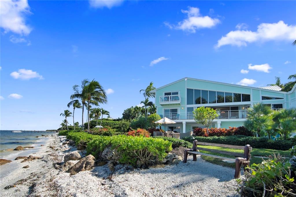 A view you won't forget, in a location you will always remember! Panoramic vistas of the calm San Carlos Bay waters from every room of this spacious 5 bedroom home with 125ft of sandy shell laden shoreline. This residence is perfectly positioned on the lot to maximize the outstanding views. Walls of glass and clerestory transoms allow for maximum natural light and the feeling of being one with the outside. This home is exceptional for entertaining and relaxing inside and out with its palatial kitchen, great room, open airy decks, and fabulous pool/spa area. In addition, there is a workshop, recreation area, three car garage and fabulous storage. An exceptional value in today's marketplace!