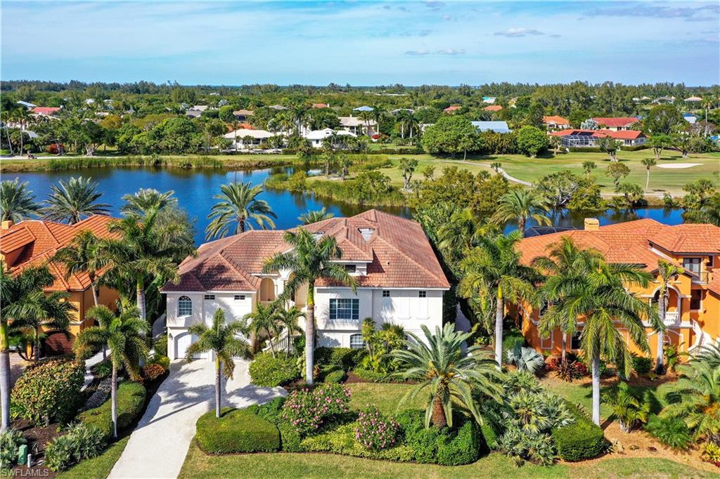 Come enjoy Sanibel living at its best with this immaculate and spacious near beach four bedroom home. This tastefully decorated residenceexudes tropical elegance nestled against a spectacular coastal backdrop with unbroken panoramic views of the canal and golf course. The open concept great roomis surrounded by large windows allowing abundant natural light to flow through the living area. If a true chef’s kitchen is what you are looking for then look no furtheras this one will not disappoint! Double wall ovens, large island, beautiful granite countertops and gas range with pot filler will delight even the most discerning cook.The luxurious master suite offers a jetted tub and huge walk in shower with multiple shower heads perfect for pampering yourself after a day of shelling. Thiswaterfront masterpiece has it all!