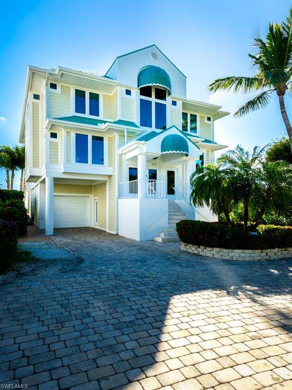 Available for the first time in 32 years, The Spoonbill, located within the confines of the luxurious Colony Beach Estates on the East end of Sanibel Island is positioned on a spectacular expanse of beachfront property overlooking the Gulf of Mexico. Meticulously remodeled in 2019, the three-story design boasts a great room accentuated with high fixed-glass windows, impact sliders to the screened lanai that looks out on Sanibels picturesque beach and sweeping Gulf view. Throughout the house are many upscale features including an elevator, wide planked wire-brushed oak floors, Jennair appliances, European cabinetry, quartz countertops, center island with wine rack, glass tile backsplash, fireplace and private pool & spa with outdoor shower. The master provides a large deck perfect for star gazing, walk-in closet, and spa inspired bath. Two guest rooms each with own bath and over 3100 sq ft of living space finish off this 3/3 beauty. This is the home to make sand castle memories in.