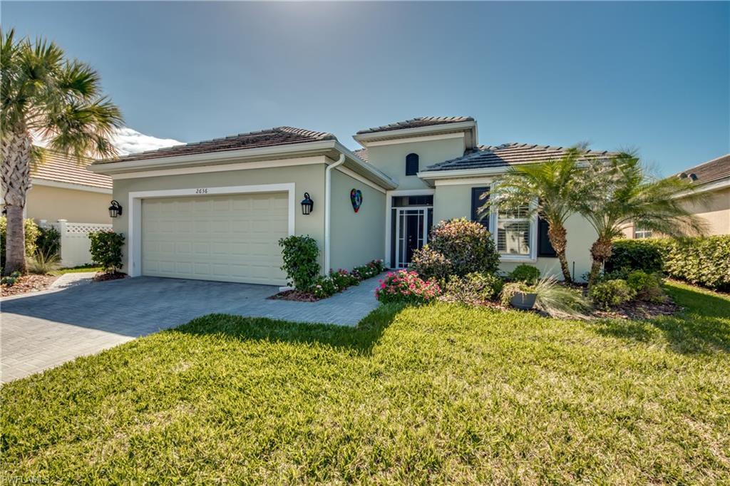 Style and sophistication grace the walls of this fabulous Sandoval home. Here you will enjoy an immaculate 3 bedroom + den home beautifully decorated & upgraded. Over $100k in builder upgrades PLUS $35k in owner upgrades. Stunning & bright greatroom style floor plan. Dream kitchen features Level 5 Quartz counters with chef island, 42" raised panel cabinets with crown, upgraded stainless appliances & pantry. Spacious master suite with walk in shower, dual sinks & custom closet. Guest bedroom with ensuite bath, additional guest bedroom/bath & den. Oversize 2 car garage extended 4' plus extended pavered lanai. Many upgrades: Custom lights/fans, wine cooler, crown molding, elec & accordion shutters, plantation shutters, paver driveway & lanai, security system, tile roof & more! Southern exposure & unobstructed lake views. Plumbing/electric for future pool. Low HOA $316/mo includes lawncare, trimming, basic cable & WIFI. Discover Sandoval's award-winning lagoon pool, water slide, children's splash area, community center, fitness center, kitchen, sand volleyball, pickleball, tennis, basketball, play field, bocce, Calypso Park with fishing pier, Barkley dog park & more!