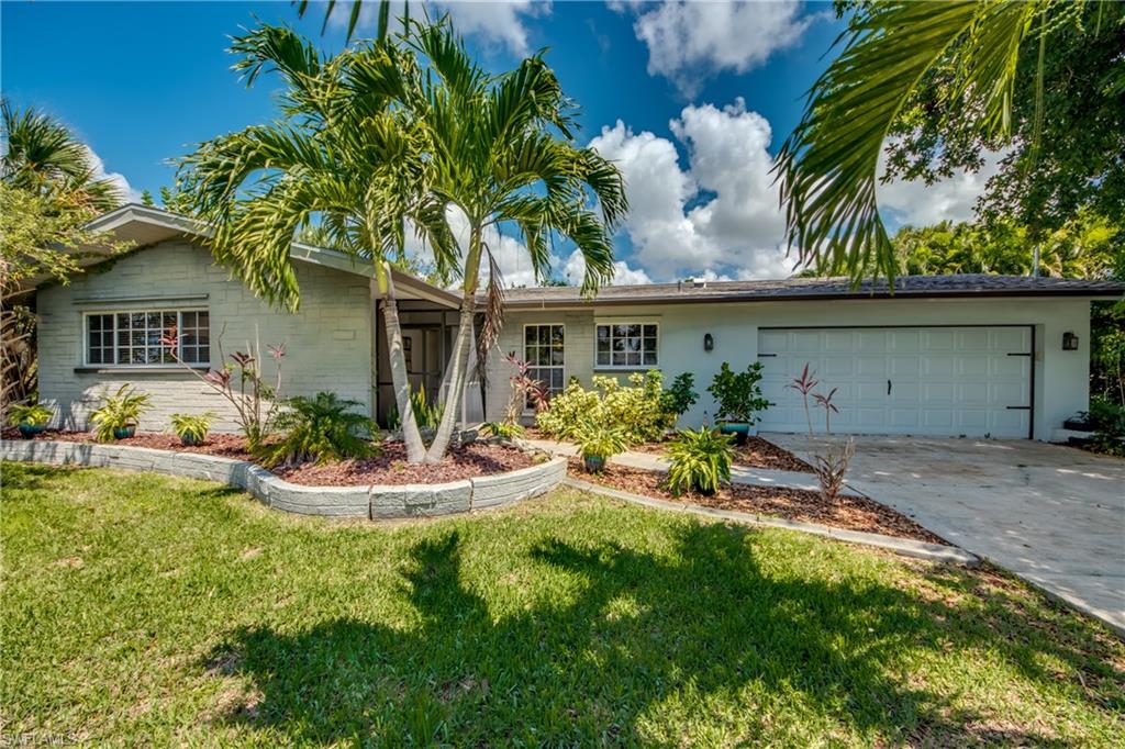 Privacy on 1/2 Acre with Tropical Gardens surrounding this Updated 3/2 Heated Pool Home with 2 car garage and Western Sunsets.  The Pool was added in 2007, roof in 2013 ! Don't hold your breath as you walk in the front door because your first look will take your breath away! Two Skylights in the living area make it bright and open.  Look through the Greatroom into the Enclosed Florida room that is a Bonus Area of 276 sq. ft not included in the sq. footage.  There is a large undercover Patio in the Pool Area w/custom waterfall on the pool.  No neighbors can be seen on this large approx. 1/2 acre property that sits on 4 Lots. A concrete pad is on the back of the property ready for your Storage Shed or boat.  There are Fruit Trees of all kinds!  Custom Garage Cabinets line the garage on 3 sides.  The Roof is 2013, New Pool Pump, A/C 2011, Microwave 2016,  New Upgraded Granite, All tile (no carpet) Laundry Tub w/washer,dryer in Garage, and ALL ASSESSMENTS PAID! Location is Prime with minutes to Bridge/Downtown/Restaurants and Walk to Publix.  Waterfront homes are across the street.  Did you ever dream all of this for under 250k?  Make your Appt. today. Your Florida dream lives here !!