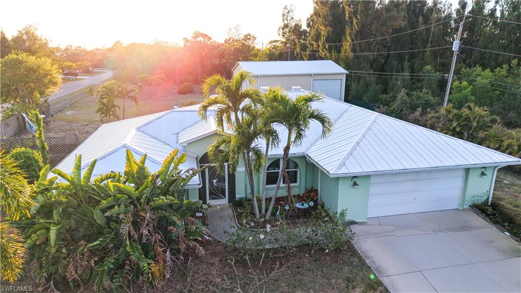 HUGH PRICE REDUCTION!!
4 bedroom/2 bath pool home! Live in the "country" and enjoy a spacious 2,200+ sq foot home. Actually the property is only 1 mile north of the "4-way stop"! Making the drive off and on the island a quick one! And you will be close to boat ramps, the island stores and restaurants. This large, comfortable home has a wonderful screened lanai that is directly off the heated pool, deck and hot tub. It has a split bedroom concept with 3 bedrooms, & 1 bath on the north side of the home and the large master ensuite is on the south side of the home. INCLUDED is an approximate 1/2 acre cleared-groomed, vacant lot being sold with the home. 5952 Porpoise Rd. PID#16-44-22-01-00000.0710-making this property approximately 1 acre! The complete property encompasses Porpoise Rd & Marlin Rd and is completely fenced!  The bonus is a Climate-Controlled 1200sq' metal RV/storage building complete with 3- 14' high rollup doors.
Property is NOT located in a flood zone. No flood insurance is required!