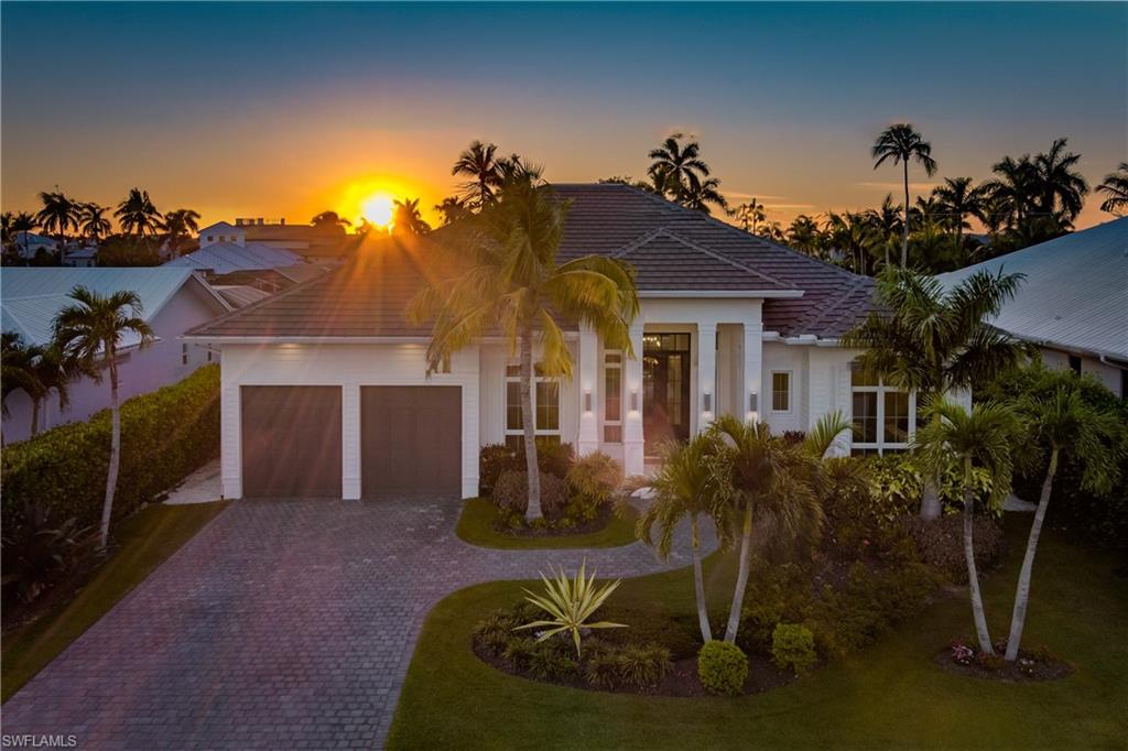 Welcome to 2150 Tarpon Road, a stunning waterfront residence designed by renowned local architect; Falcon Design, and crafted by prominent Naples home builder; GWB Custom Homes in 2022. This barely lived-in masterpiece boasts 4 bedrooms plus a den, along with 4 1/2 bathrooms, ensuring ample space and comfort for luxurious living. 

This Ideal boaters’ paradise is located on one of the deepest canals in the coveted Royal Harbor community, nestled between wide intersecting t-inlets, with direct access to Naples Bay and the Gulf of Mexico. With Western exposure, picturesque sunsets are bound to be a daily spectacle, creating an ambiance of tranquility and serenity.

Upon entering, you're greeted by unparalleled craftsmanship and quality with custom cabinetry and top-of-the-line commercial-grade Thermador appliances adorning the chef's kitchen. The open-concept living space features soaring vaulted and tray ceilings. Premium 12’ tall hurricane impact sliding doors allow for indoor/outdoor access to your screened-in lanai. Outdoor entertaining reaches new heights with a built-in outdoor kitchen, and a separate outdoor living space featuring a 60” gas fireplace. Take a step further outside to discover your own private oasis, complete with a sparkling lap pool, and spa, perfect for unwinding in the Florida sun. 

Boating enthusiasts will delight in the convenience of canal access, with over 80’ of seawall, ready for the addition of a future dock/lift, allowing effortless exploration of the surrounding waterways. A 1,000-gallon in-ground propane tank powering a 22kw generator, provides peace of mind, ensuring uninterrupted comfort and security. 

Located just minutes away from historic downtown Naples, Third Street, Naples Beach, and much more. Whether you're entertaining guests on the spacious patio, unwinding in the serenity of the waterfront, or enjoying a night on the town, this home provides the ultimate Florida lifestyle experience.