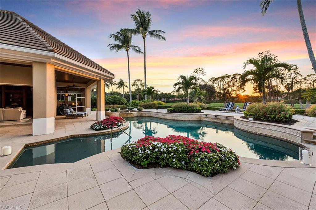 Immerse yourself in the privacy, space, and comfortable elegance of this luxurious Naples estate that commands sweeping lake and golf course views. Nestled on a quiet cul-de-sac on 0.74 acres, this stately home offers expansive, western exposure overlooking the 16th fairway of the Pine Course. London Bay Homes crafted an impressively beautiful, 5,500 square foot residence with neutral stone flooring, detailed cypress wood ceilings, impeccable millwork throughout, and the perfect floor plan for privacy, yet plenty of space for guests, with four bedrooms, five and one half baths, custom office with rotunda ceiling, gourmet kitchen, high-end appliances, and pocketing sliders that lead to spacious, outdoor living, both screened and open to your resort views.  Enjoy get togethers in the screened lanai with outdoor kitchen, fireplace, and large dining and sitting area. This gorgeous residence truly has it all, including a new roof in 2019, three-car garage, Lutron, and air-conditioned storage rooms. Grey Oaks is a world-class Club with three golf courses, a 30,000 sq. ft. Wellness Center, Spa, two club houses, pickle ball, and so much more, with central Naples, location...welcome home!