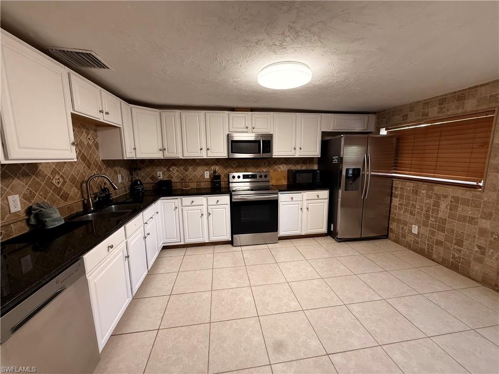 Short term or Long term rental available now! This spacious 4-bedroom plus den, 2-bath home is located in the highly desirable Poinciana Village, just minutes from Downtown Naples, beautiful Gulf beaches, shopping, dining, parks, and top-rated schools. The home features a bright and open floor plan with tile flooring throughout, a large kitchen with granite countertops and stainless steel appliances, generous living and dining areas, and a versatile den that can be used as a home office, playroom, or additional living space. The split-bedroom layout offers comfort and privacy, while the fully fenced backyard provides plenty of room to relax or entertain. A 2-car attached garage, spacious driveway, and washer and dryer are included for your convenience. No HOA and no rental restrictions! Bring your boat, RV, trailer, or work vehicle with no community restrictions. Enjoy the perfect combination of space, flexibility, and an unbeatable central Naples location. Available for immediate occupancy, schedule your private showing today!
