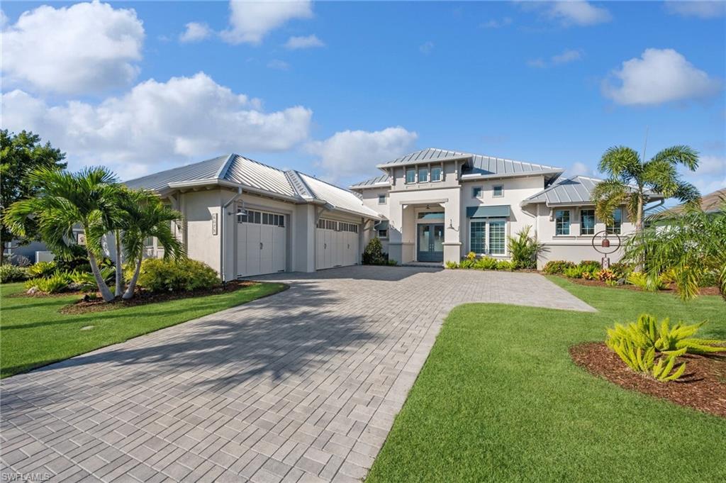 H13335-SIMPLY PARADISE! Picture-perfect lakefront luxury home with spectacular sunsets! Stock-built in 2021, this 3641 SF COCOPLUM model sits on quiet street in sought after Isles of Collier Preserve. Great curb appeal with paver driveway, 3 bay garage, ALL METAL ROOF & custom landscaping. Enjoy peace of mind with impact glass, hurricane screens, whole-house generator, 1000 gal propane tank, EV charger. Rejuvenate in the heated saltwater pool/spa. Fireplace, tile flooring, upgraded fixtures, plantation shutters and lighting. You will love cooking in the gourmet kitchen with double island and custom walk-in pantry and relaxing after dinner on the covered screen lanai. Isles of Collier Preserve is a resort community ideal for an active lifestyle with state-of-the-art fitness center, lap pool, tennis, pickleball, kayaking and trails for biking, walking and daily bird watching. Ibis, blue heron, snowy egrets & bald eagle visit! The on-site restaurant makes it easy to enjoy lunch poolside or an island-style dinner from the lakeside Overlook Bar & Grill. Great locale near 5th Ave with its world-renowned dining & shops, close to boat marinas, championship golf and USTA pickleball courts.