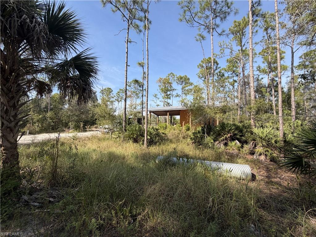 Opportunity knocking for the builder or dreamer. Amazing IMPROVED LAND ready for your private, country home! Permitted well on site (needs well pump), temporary electric pole & septic system too!  Residential zoned CLEARED LAND with a giant pole barn, pavers and an attached workshop with a bathroom. You will love the tranquility of this rural, dead-end gravel road in the highly desirable Nalle Grade neighborhood just off Bayshore Rd (a major thoroughfare) and minutes from I75.