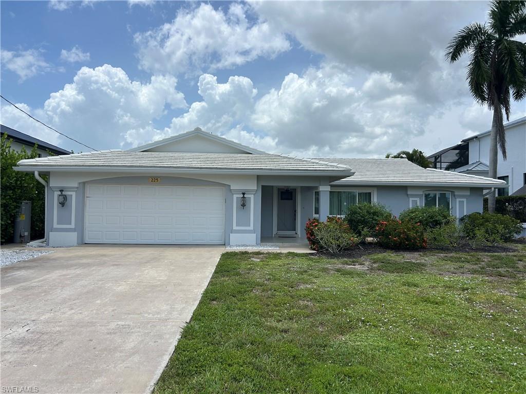 Why rent a boat slip when you can have your own included with this exceptional waterfront rental? This beautifully updated three-bedroom plus den, two-bath home with a two-car garage offers the ultimate Southwest Florida lifestyle for $4,200 per month. Ideally situated on a scenic canal with direct Gulf access, you’ll be just 15 minutes to open water via Wiggins Pass with no bridges, making it a boater’s dream. The property includes a covered 13,000-pound boat lift and is within walking distance of Barefoot Beach, with several other world-class beaches just minutes away. The spacious and flexible floor plan features three bedrooms plus a den, providing plenty of room for family, guests, or a home office. The expansive primary suite offers additional space for a sitting area or workout room. Both bathrooms have been beautifully updated with quality tile, cabinetry, and modern finishes. The upgraded kitchen features newer cabinetry, appliances, and stylish finishes, making it perfect for everyday living and entertaining. Recent improvements include impact-resistant windows, a new tile roof, a travertine pool deck, and a newer wraparound dock with a covered canopy over the boat lift. Relax by the heated pool, unwind in the covered lanai, or entertain on the expansive sun deck overlooking the canal. Launch your boat or kayak from your own dock and enjoy easy access to nearby waterfront restaurants and the Gulf. This is a rare opportunity to rent a truly exceptional waterfront home in one of Southwest Florida’s most desirable locations.