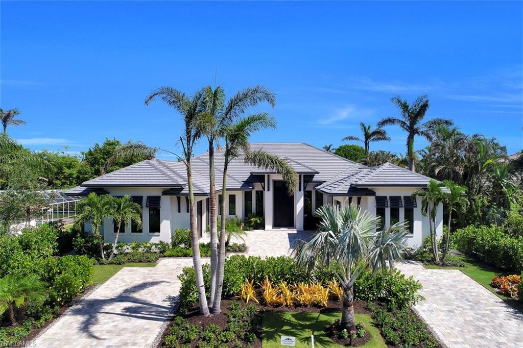 H.13060 - This Knauf-Koenig Group masterpiece sits in the heart of the Moorings community. Its sprawling single level design, along with a well-appointed chef’s summer kitchen, outdoor dining and living spaces, and a resort style pool; allow for effortlessness transitions from outdoor to indoor living. In addition to the expansive Master Suite there are 4 Guest Suites providing ample space for all your visitors. If this prominent Naples address suddenly increases your need for guest rooms… the third garage stall has all the provisions to be easily converted into a detached guest suite. ADDITIONAL FEATURES OF THIS HOME INCLUDE: a three car garage, an attached carport, roll down shutters, roll down shades, impact windows and doors, European Oak wide plank flooring, quartzite and marble counter tops, Wolf Sub-Zero appliances, outdoor fireplace, and eligibility for membership to the private Moorings Beach Park.