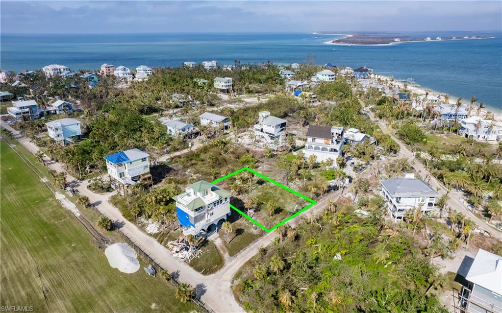 This is an exceptional buildable lot! Steps from the sugar sand beaches of North Captiva and the runway. Build your dream home or keep it simple and use the same builder that would have built for the seller's. Royal Corinthian Homes has a build design for this lot to see panoramic views with 5 bedrooms & 3 1/2 baths. Large open floor plan on top floor with kitchen & living area with sliders across entire house. Large picture window on the side of house to optimize water views. Master suite on the 3rd floor where the main living space and powder bath are. First flight has 4 bedrooms with a Jack and Jill bath and laundry room. You can also choose your own builder. Short walk or golf cart ride to beautiful wide sandy beaches, state preserve, restaurants, resort-style amenities & a ferry landing. Once built this would be a great potential for vacation rental income, secondary home or primary home.