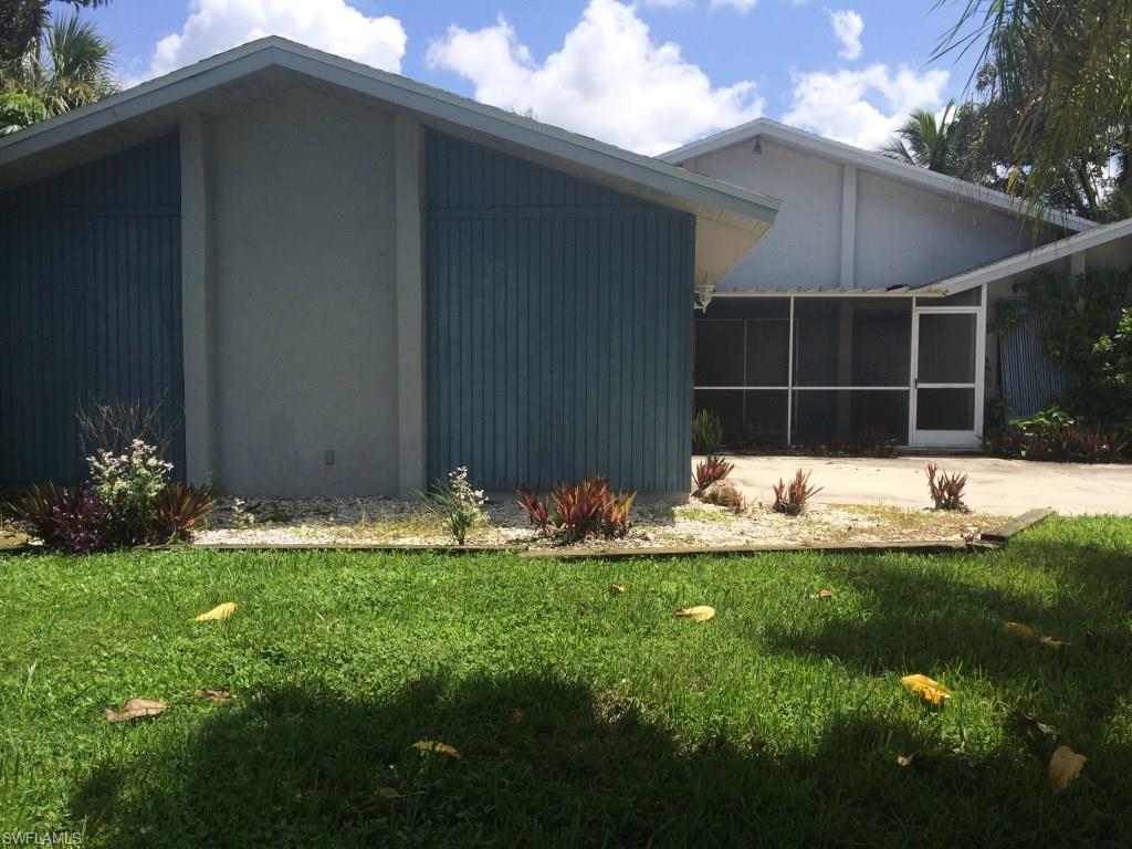 REDUCED!!! Serious Boaters, your home awaits. No bridges or restrictions and just minutes to the River! Great location, short drive by car or boat to restaurants, shopping,  entertainment and the Yacht Club. 
Large open great room with vaulted ceiling, fireplace, and lots of sliders to lanai & oversized screened in pool. 
Home features a 2 car side load garage and  fenced in yard. A little TLC and some updating and you can make this home your own. This has been in a rental program and can rent for  $1600 per month. Perfect for the investor or until you tear down and build your dream home!