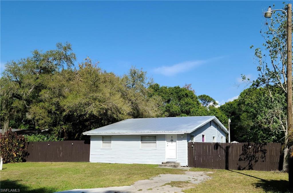 This is a 3-bedroom 2 bath single family home with a beautiful fenced yard situated on an oversized lot, on a quiet and private street just off US 41, with easy access to Highway I-75, Downtown Ft Myers entertainment, shopping and dining. Many updates that include Stainless steel appliances and new flooring throughout, fresh interior paint, new metal roof, water heater, wood fence and water softener, A/C from 2015. Home needs renovation finishes and the master bath is ready for your design (plumbing is ready). Request your showing today!