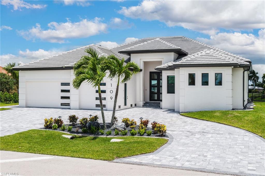 SELLER IS EAGER & DETERMINED TO CLOSE A DEAL QUICKLY! CLAIM THIS GORGEOUS NEW CONSTRUCTION HOME TODAY! Gulf Access! Completely Furnished! Selling Turnkey! Triple Lot! Greeted by beautifully crafted 10' oil rubbed bronze iron front doors. This new construction home features 12' ceilings 14' floating tray with rope lighting in great room, dining room & primary suite, granite throughout, custom electronic window treatments throughout with true stainless-steel appliances in kitchen. This house also has endless upgrades including a built-in entertainment center with an electric fireplace, a security/surveillance system, outdoor kitchen and Sonos sound system, open air pool deck, over-under-in cabinet lighting in kitchen, custom shelving in hidden kitchen pantry, custom closet designs in guest bedrooms and guest hall closet, in addition to custom designs in master. You will be ready for any Florida weather with hurricane impact doors and windows. This home has exterior features just as breathtaking as the interior including soffit lighting along the perimeter, & custom insulated hurricane impact garage door. Why wait to build a custom home when you could be living in one now!