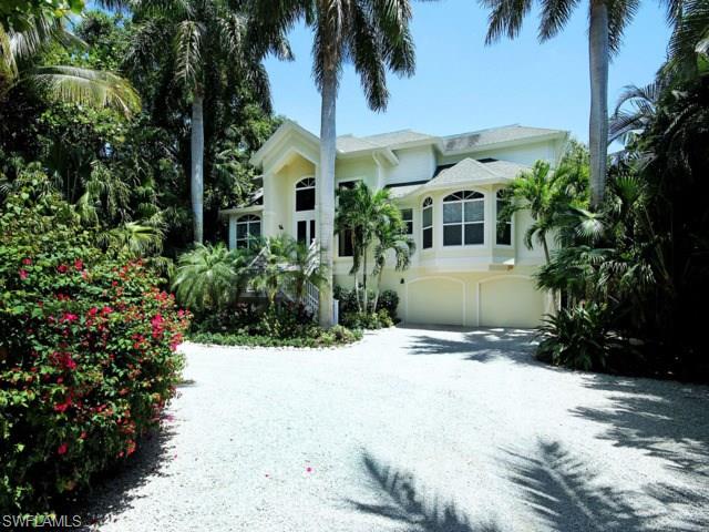 Your own private paradise "Captiva Charm" awaits you at the end of a 500' private driveway running through lushly vegetated grounds. Gorgeous direct bayfront estate home overlooks Roosevelt Channel, with boating & fishing from your own private dock with 10,000lb boat lift. Relax outdoors; wooded & private with large fenced area for garden parties, open pool & porches overlooking the bay. Beautifully appointed elevated home features 4 of the bedroom ensuite, a second kitchen & den, granite, stainless & wood kitchens, soaring two-story living room with gas fireplace & so much more! Includes beach access.