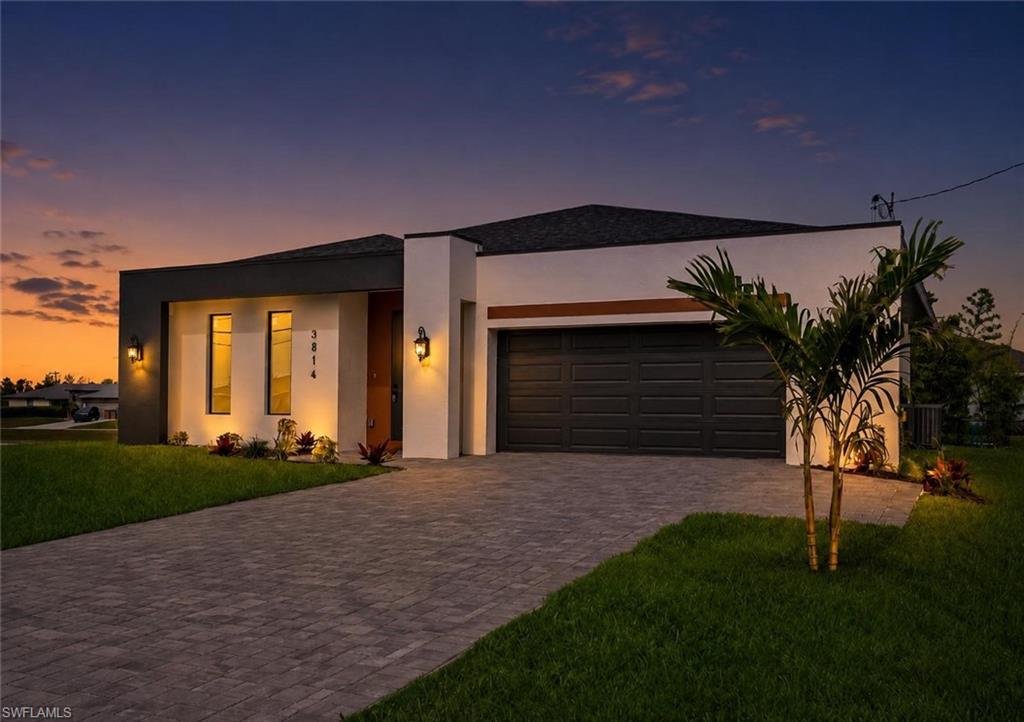 NEW CONSTRUCTION + $10,000 TOWARD BUYER CLOSING COSTS OR RATE BUY-DOWN! This move-in ready home in a desirable NE Cape Coral area, this thoughtfully designed home sits on a spacious lot of 12,147 square feet, outside of a flood zone. Featuring 3 bedrooms plus a den, 2 bathrooms, and 1,776 square feet of living space, the residence offers premium finishes and custom details throughout.
The open-concept floor plan showcases quartz countertops, a custom wood-slat island, decorative penny-round mosaic backsplash, stainless steel appliances, soaring ceilings, wood-look porcelain tile flooring, and abundant natural light. The versatile den is ideal for a home office, study, guest room, or flex space.
Additional features include impact-resistant windows and doors, a covered lanai, paver driveway, and a fully finished two-car garage with epoxy flooring. With no HOA fees and no outstanding assessments, this property offers both freedom and value. The oversized homesite provides added privacy and ample room for a future pool and outdoor living area.