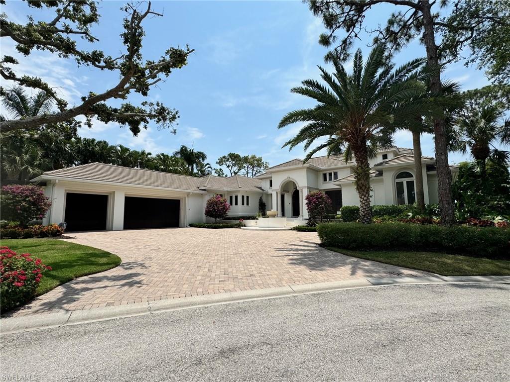 Beautifully updated home on a quiet cut de sac in Creekside of Bonita Bay! Gorgeous wide lake view, open floor plan, additional second floor en suite, 4 bedrooms, massive outdoor space with kitchen and fireplace - homes like this one are RARE!
