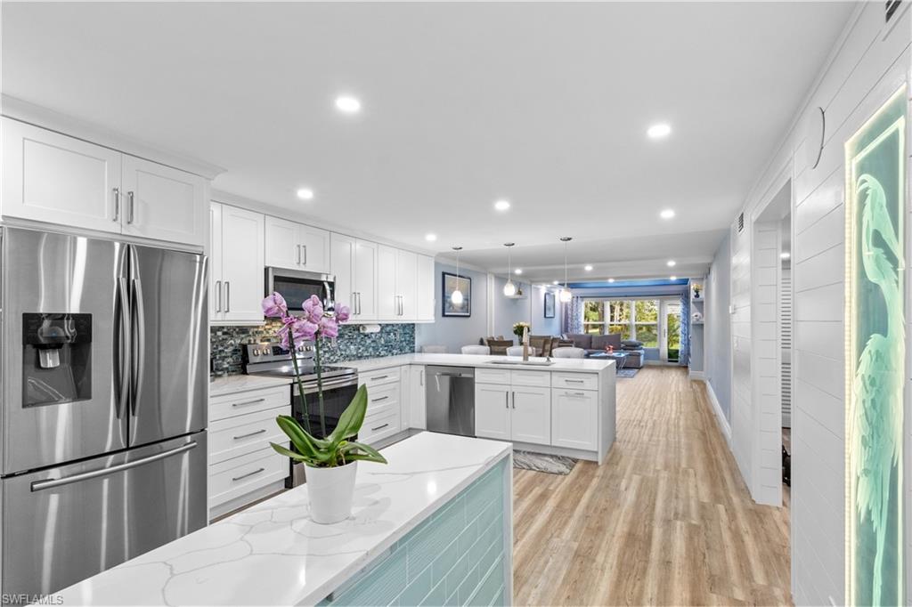 4140 Looking Glass Ln #3815 is a move-in-ready 2-bedroom, 2-bath condo for sale in Winterpark, one of Naples’ established communities with resort-style amenities and a convenient location. Offered at $329,900, this updated Naples condo features a fully redesigned kitchen with white cabinetry, stainless steel appliances, a stylish backsplash, large breakfast bar, and an open layout connecting the kitchen, dining, and living areas.
The interior has a clean coastal feel with updated flooring, recessed lighting, modern finishes, and a spacious living room overlooking a peaceful outdoor setting. The owner’s suite includes custom closet space and an updated bathroom with a walk-in shower. The second bedroom and bathroom provide flexibility for guests, seasonal use, or a home office. A standout feature is the custom laundry and wine cellar area, adding valuable function and a unique touch.
Winterpark amenities include a resort-style community pool, clubhouse, community room, pickleball, tennis, bocce court, bike and jog path, bike storage, extra storage, and internet access. The HOA includes cable, insurance, internet/WiFi access, irrigation water, lawn and land maintenance, reserves, sewer, street lights, street maintenance, trash removal, and water. For buyers searching for Naples condos for sale, a move-in-ready condo in Winterpark, or a well-updated property near shopping, dining, beaches, and downtown Naples, this is a strong opportunity.